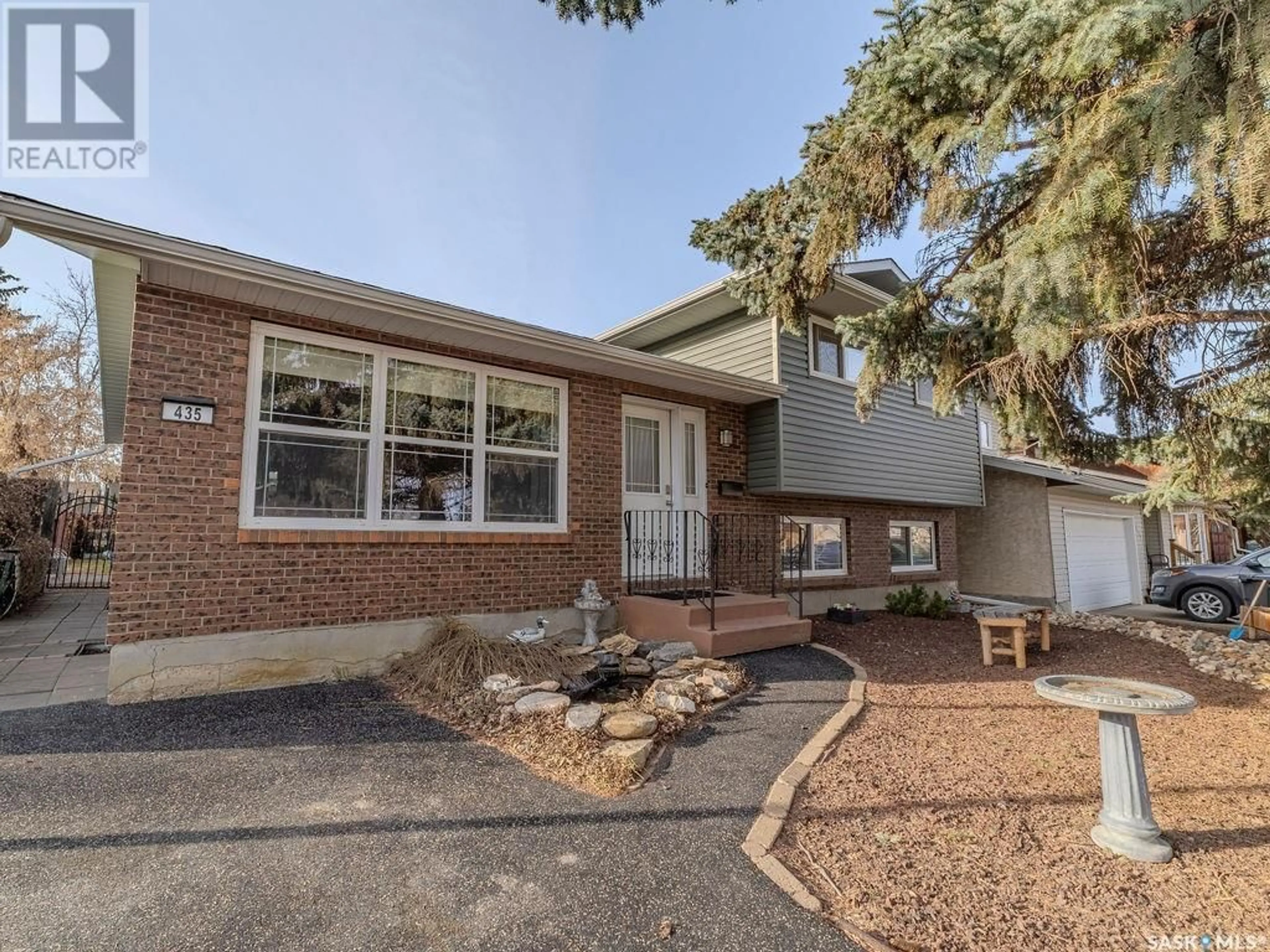 Home with brick exterior material, street for 435 CHARLEBOIS WAY, Saskatoon Saskatchewan S7K5J8