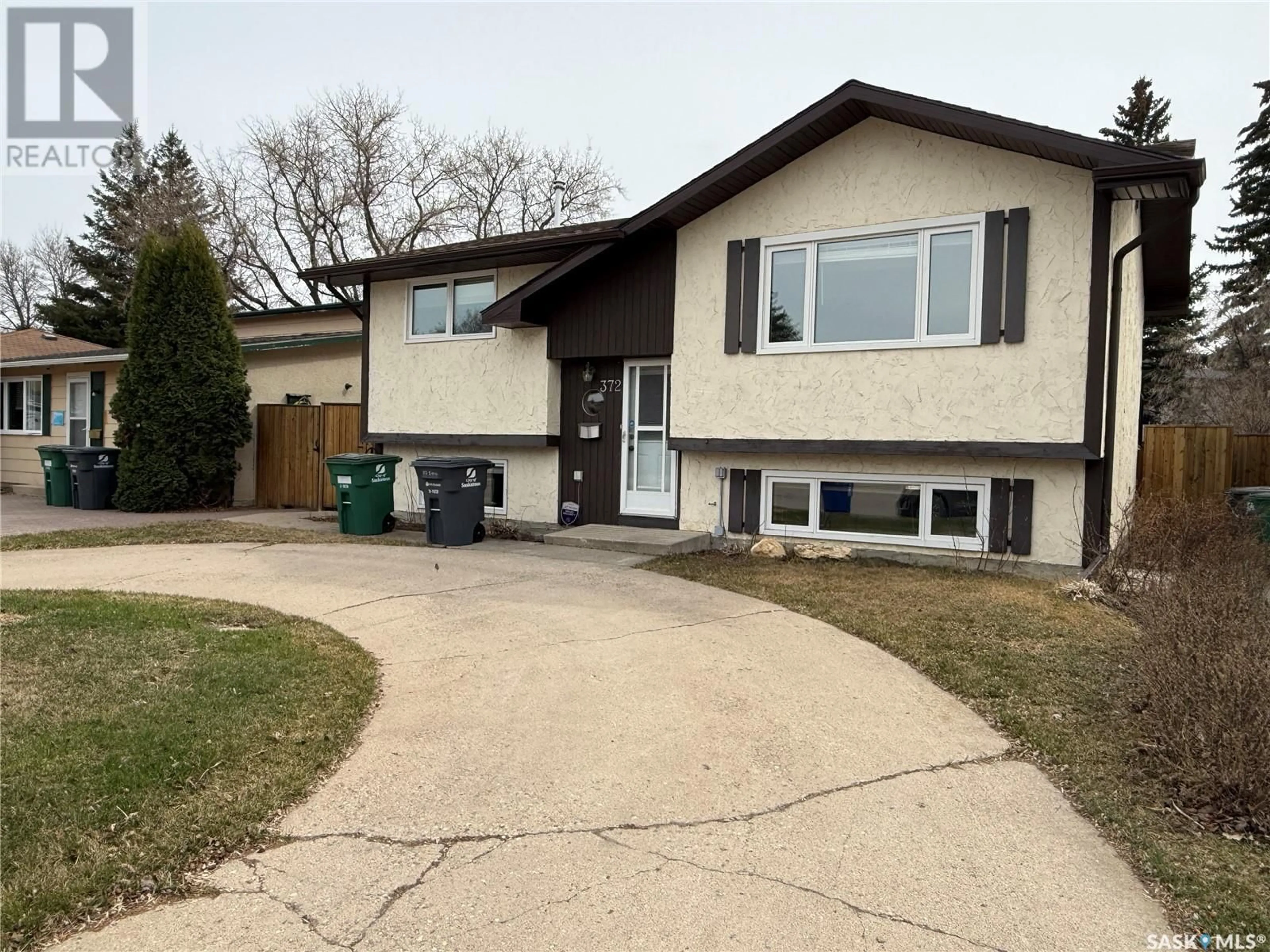 Home with vinyl exterior material, street for 372 BIRCH CRESCENT, Saskatoon Saskatchewan S7N2M6