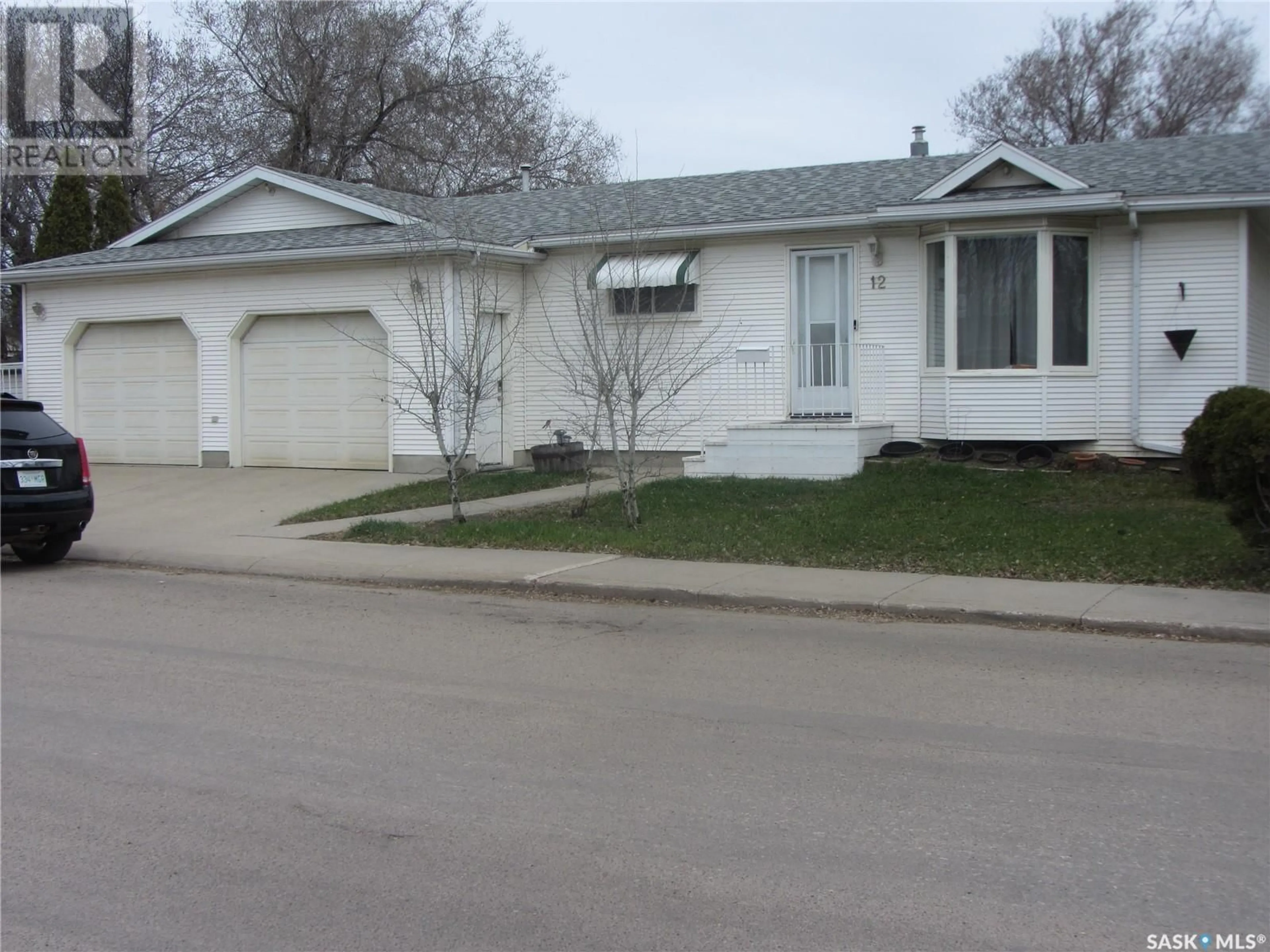 Home with vinyl exterior material, street for 12 GLENWOOD AVENUE, Saskatoon Saskatchewan S7L4A6