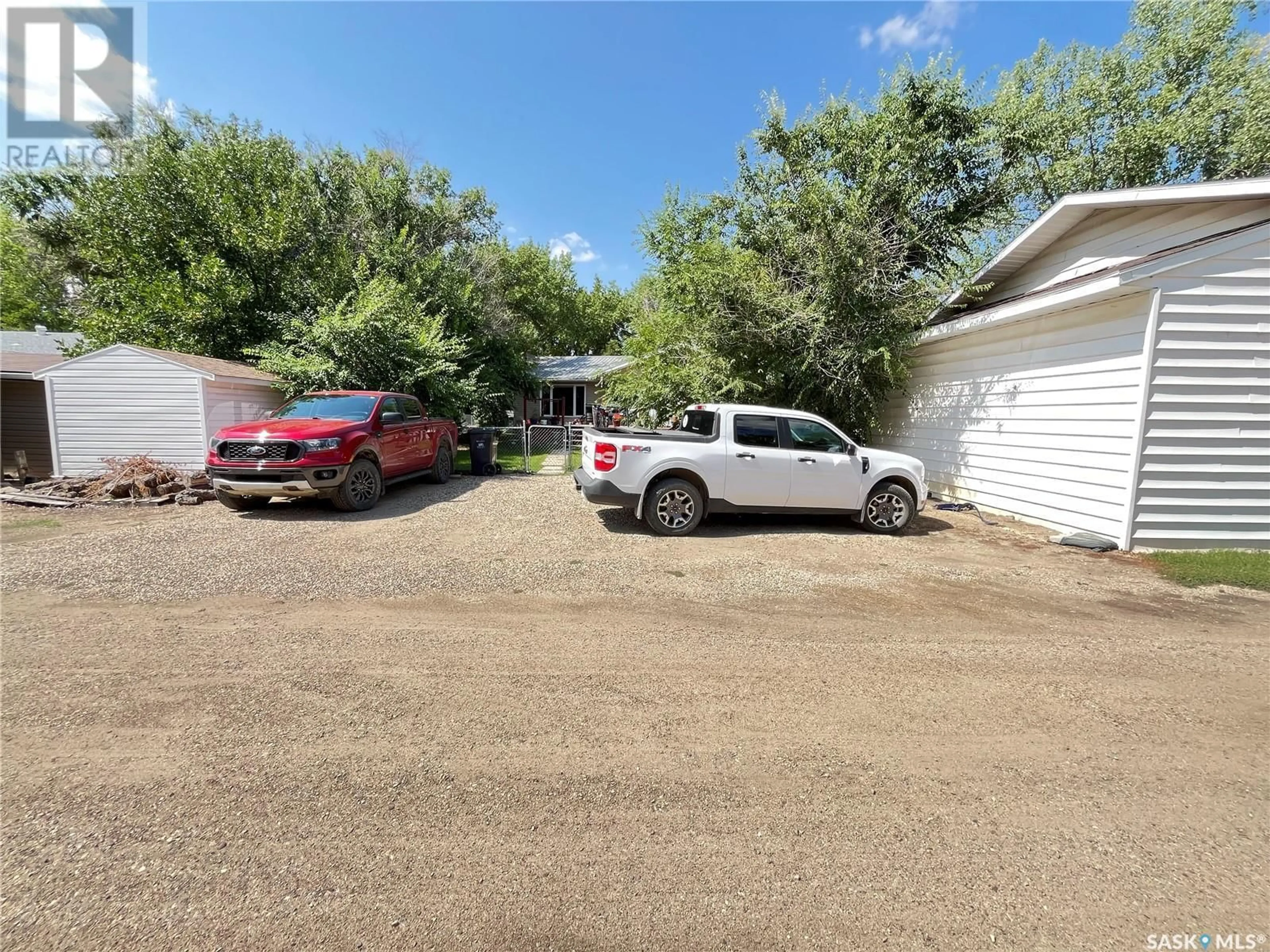 A pic from outside/outdoor area/front of a property/back of a property/a pic from drone, street for 202 HOOD STREET, Maple Creek Saskatchewan S0N1N0