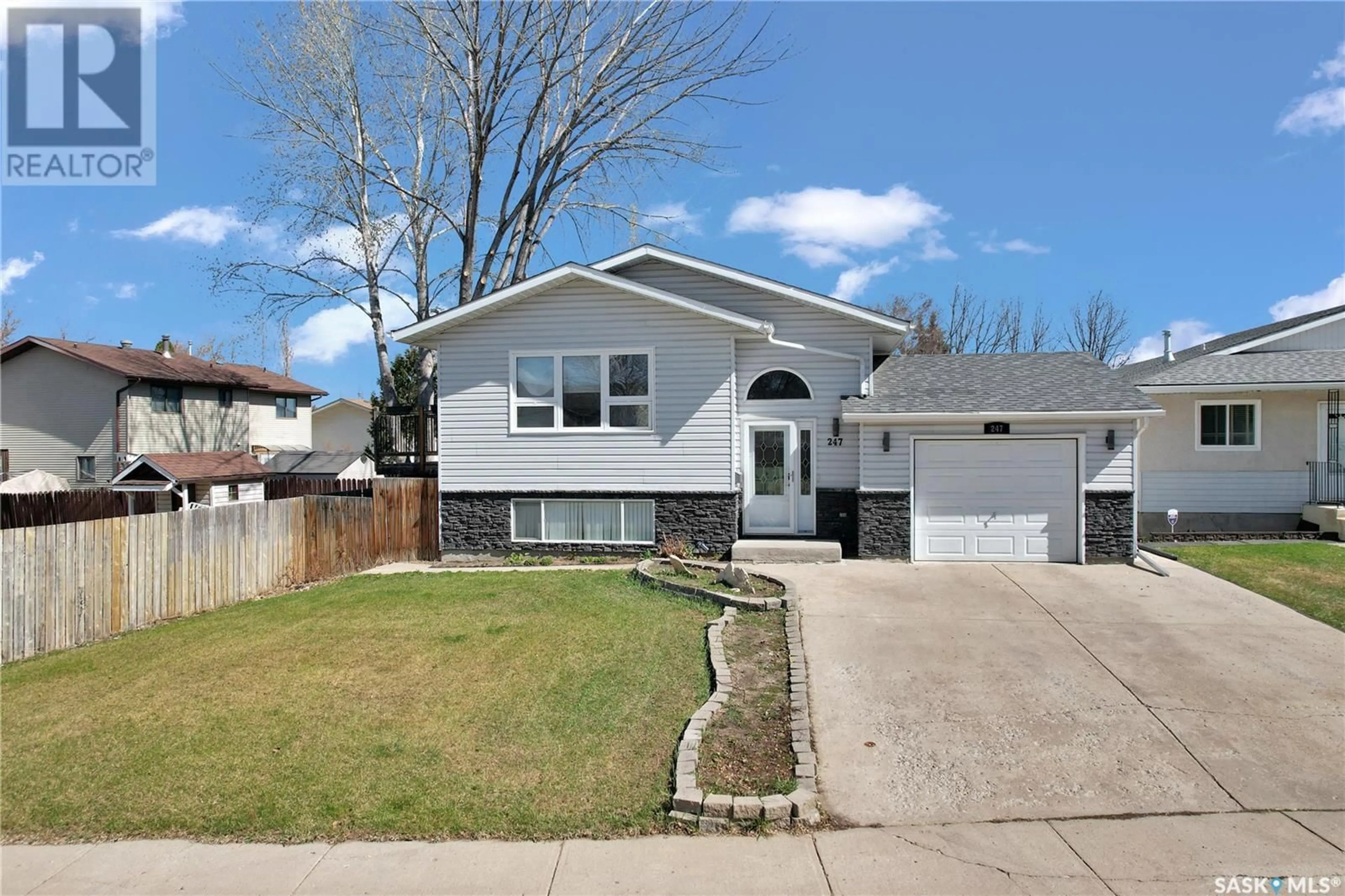 Home with vinyl exterior material, street for 247 O'REGAN CRESCENT, Saskatoon Saskatchewan S7L6N4