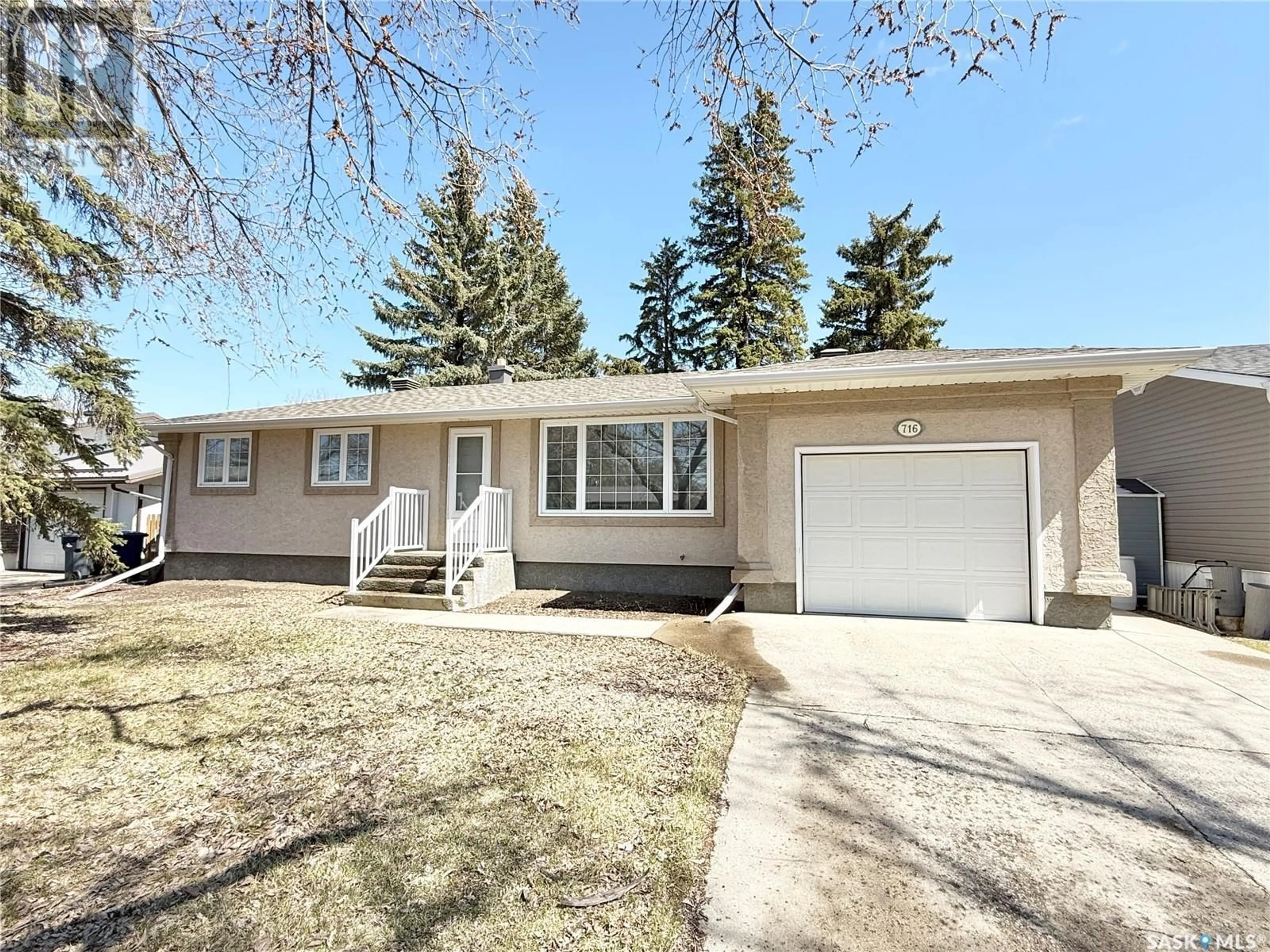 Home with vinyl exterior material, street for 716 WINDSOR STREET, Weyburn Saskatchewan S4H0X4