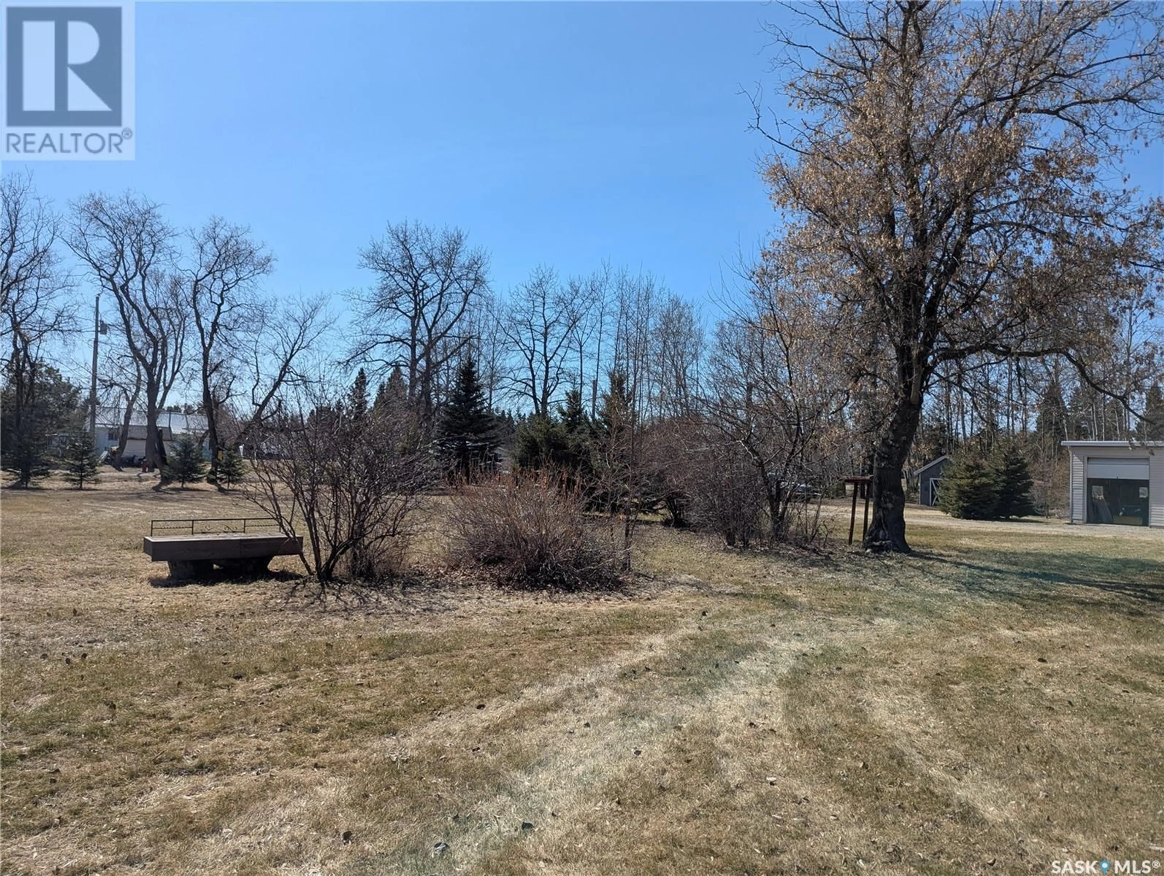A pic from outside/outdoor area/front of a property/back of a property/a pic from drone, forest/trees view for 129 LEMIEUX CRESCENT, Leoville Saskatchewan S0J1N0