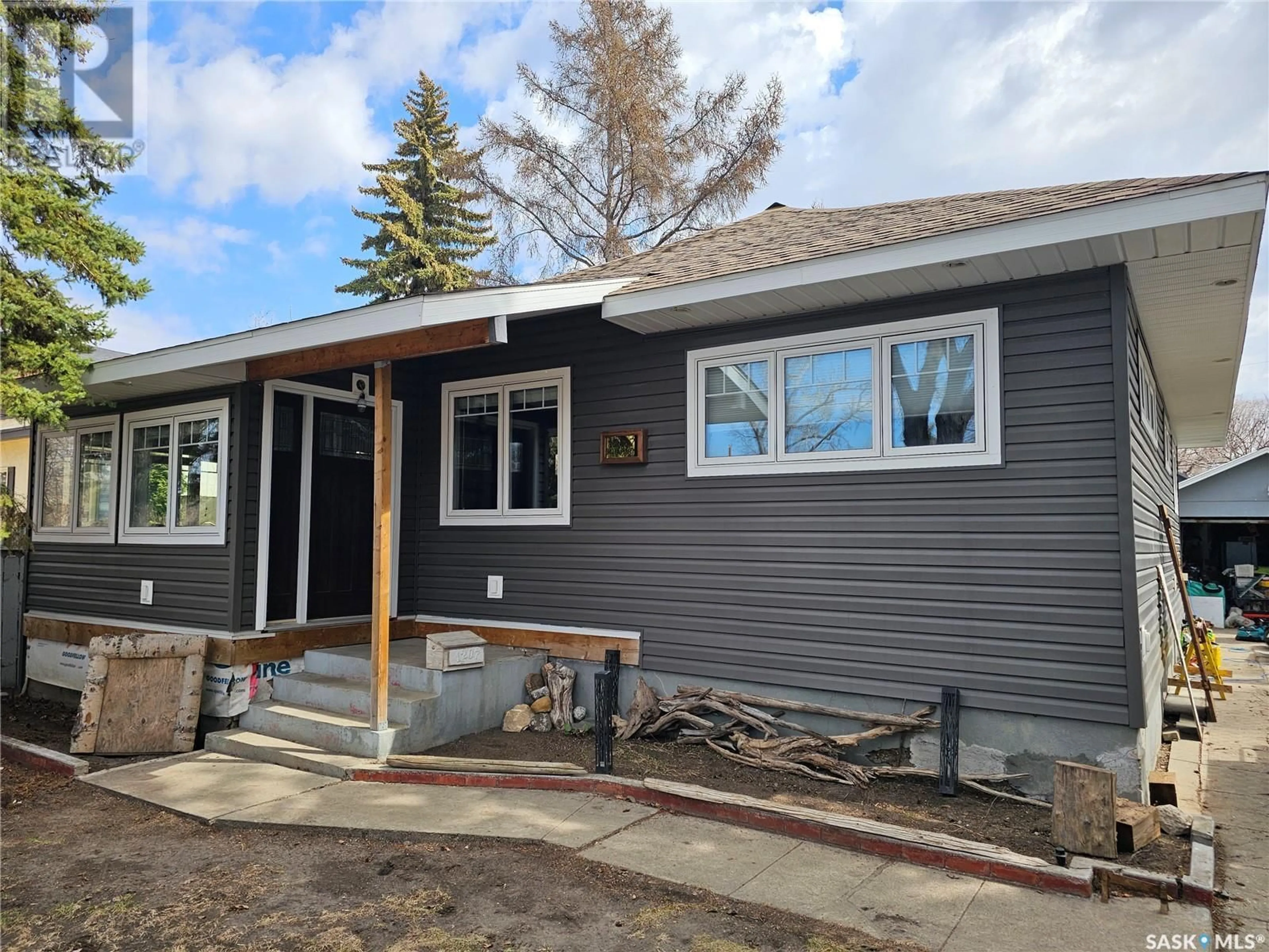 Home with vinyl exterior material, street for 1207 KILBURN AVENUE, Saskatoon Saskatchewan S7M0J6