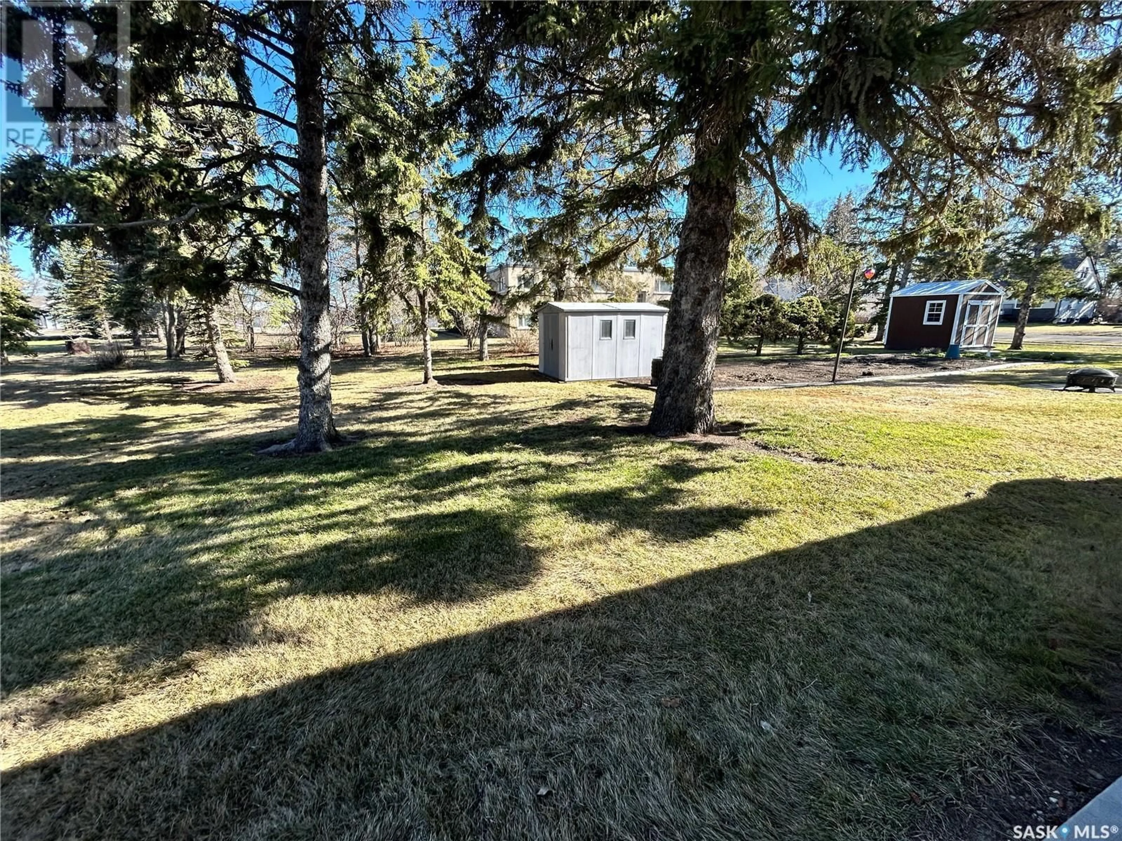 A pic from outside/outdoor area/front of a property/back of a property/a pic from drone, forest/trees view for 603 2ND STREET N, Langenburg Saskatchewan S0A2A0