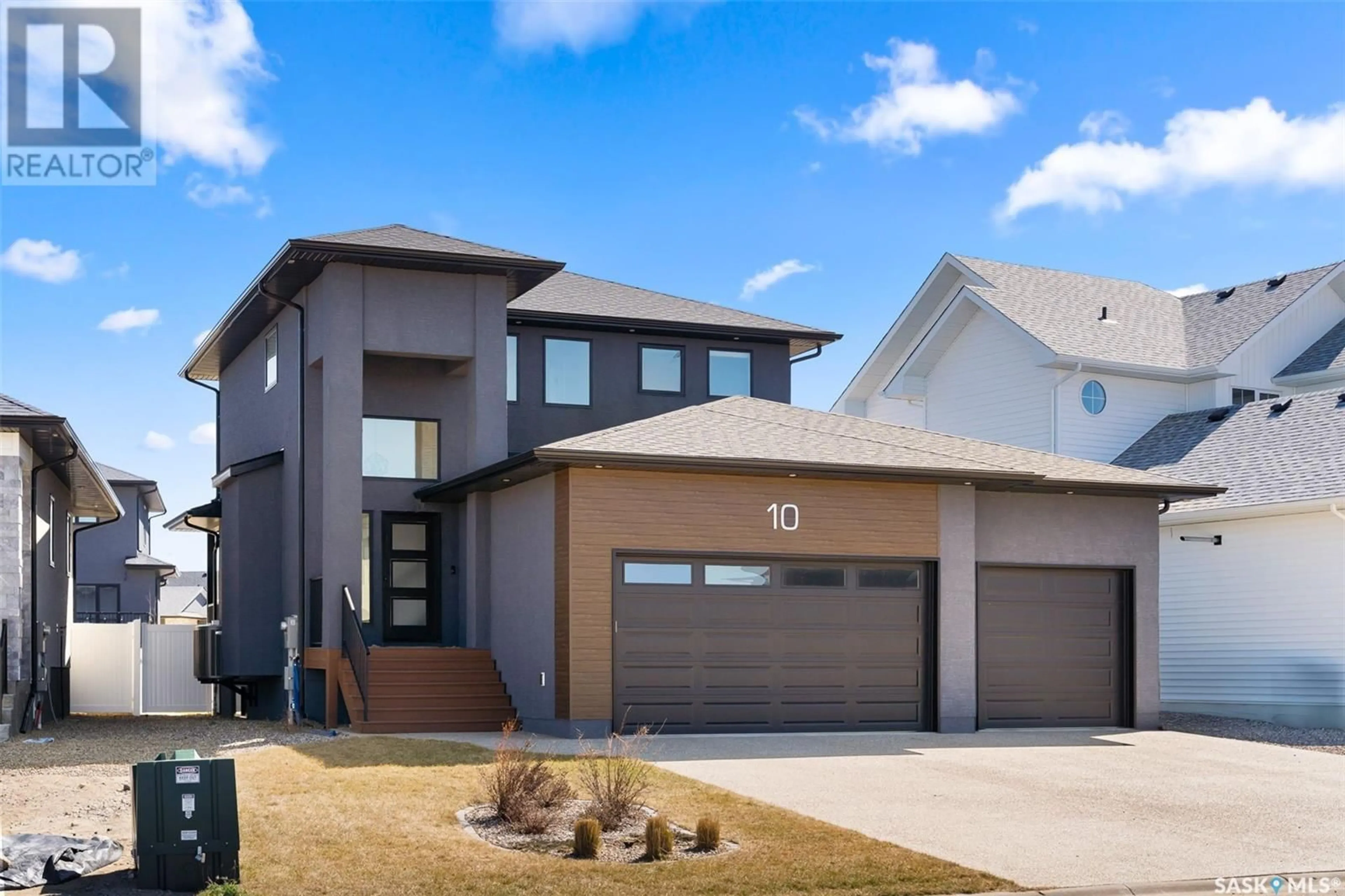 Home with vinyl exterior material, street for 10 LOOKOUT DRIVE, Pilot Butte Saskatchewan S0G3Z0