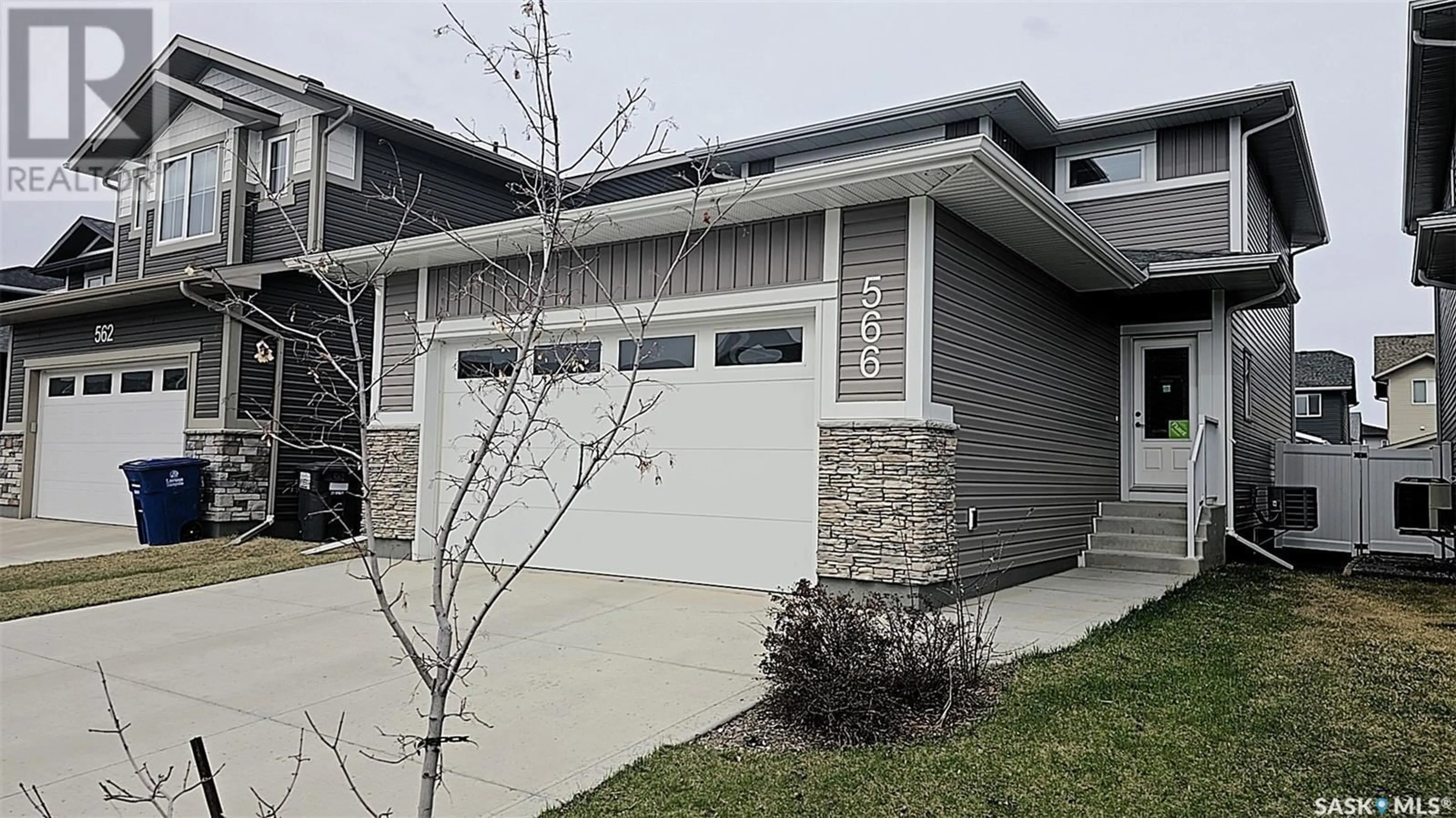 Home with vinyl exterior material, street for 566 MCFAULL CRESCENT, Saskatoon Saskatchewan S7K8B3
