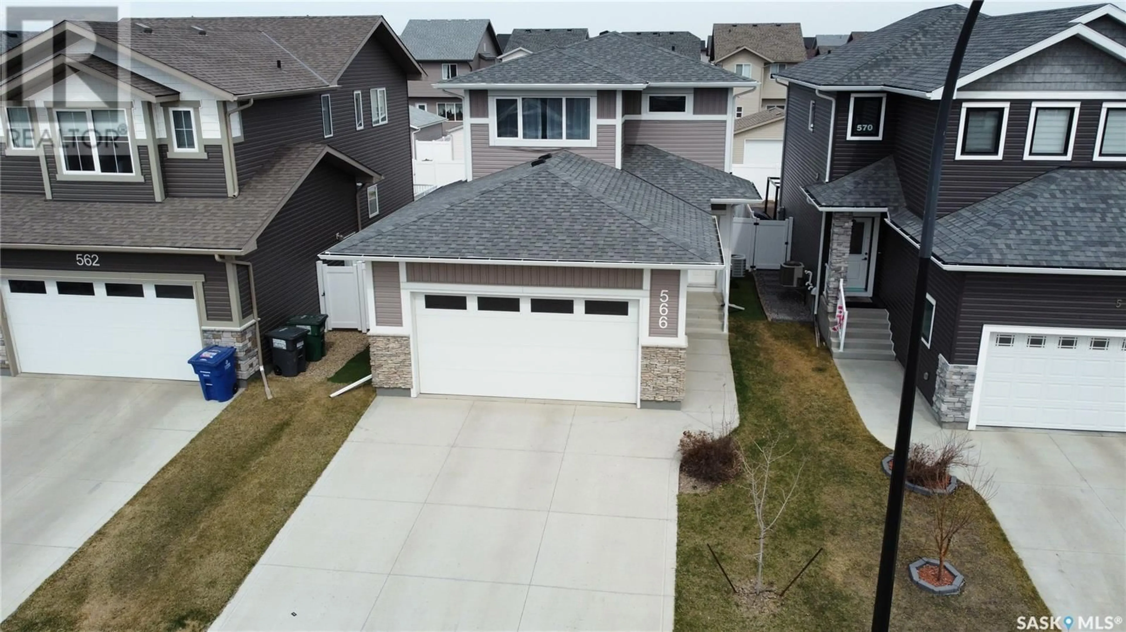 A pic from outside/outdoor area/front of a property/back of a property/a pic from drone, street for 566 MCFAULL CRESCENT, Saskatoon Saskatchewan S7K8B3