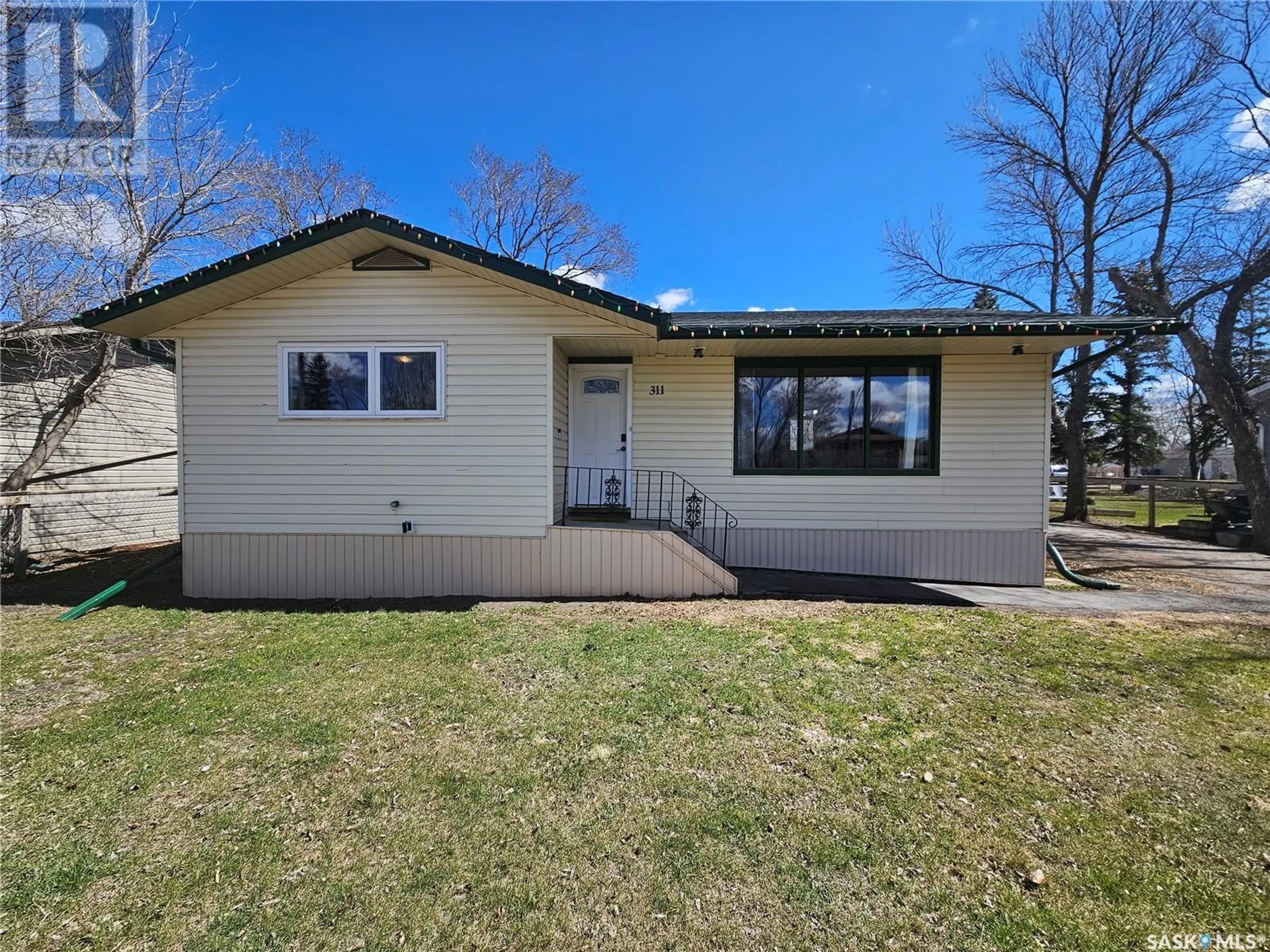 Home with vinyl exterior material, street for 311 7TH STREET, Carlyle Saskatchewan S0C0R0