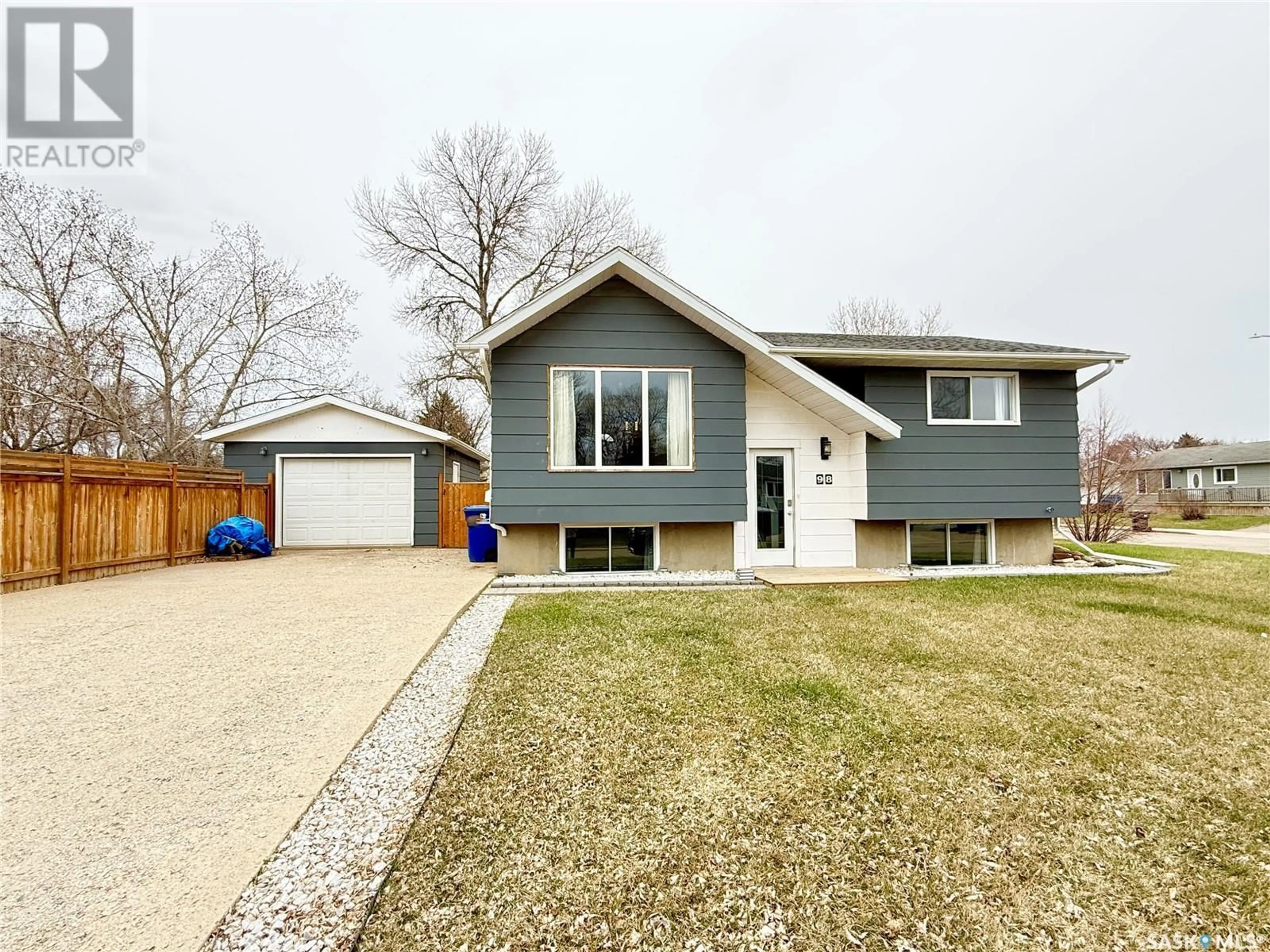 Home with vinyl exterior material, street for 98 14TH STREET, Weyburn Saskatchewan S4H2N2