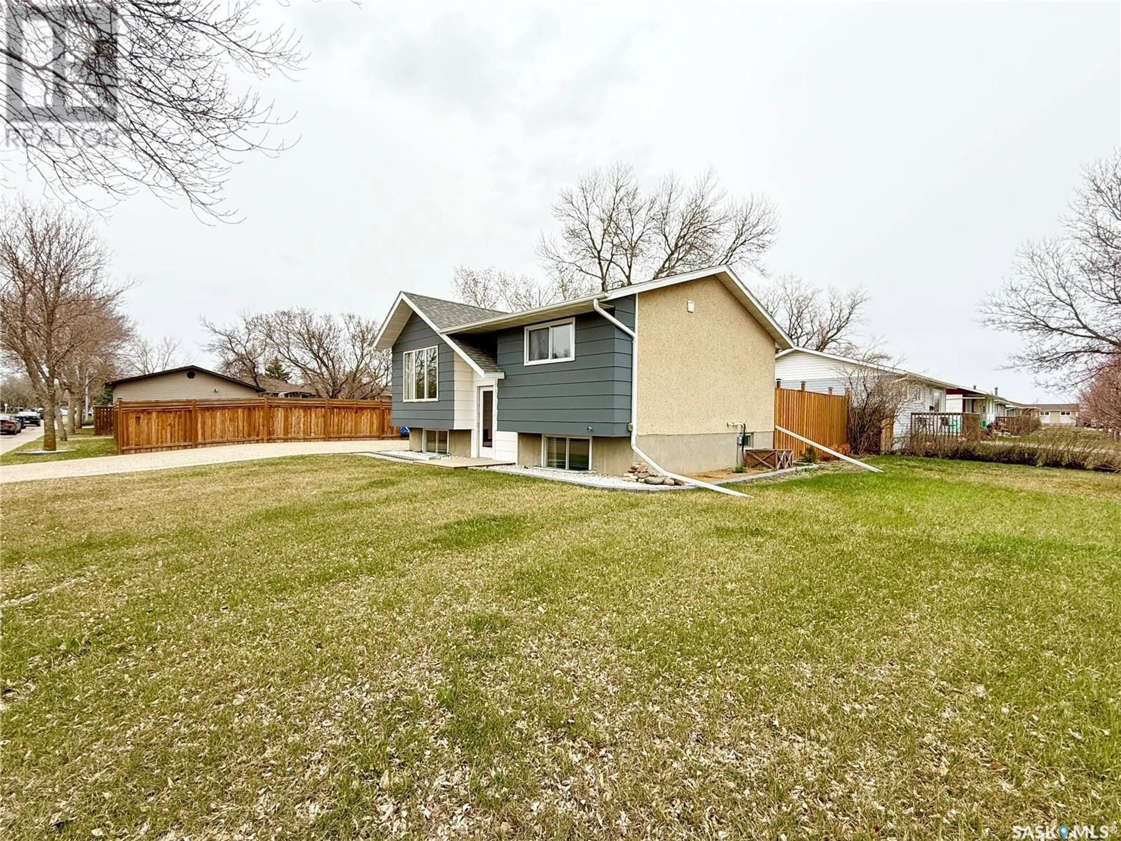 A pic from outside/outdoor area/front of a property/back of a property/a pic from drone, street for 98 14TH STREET, Weyburn Saskatchewan S4H2N2