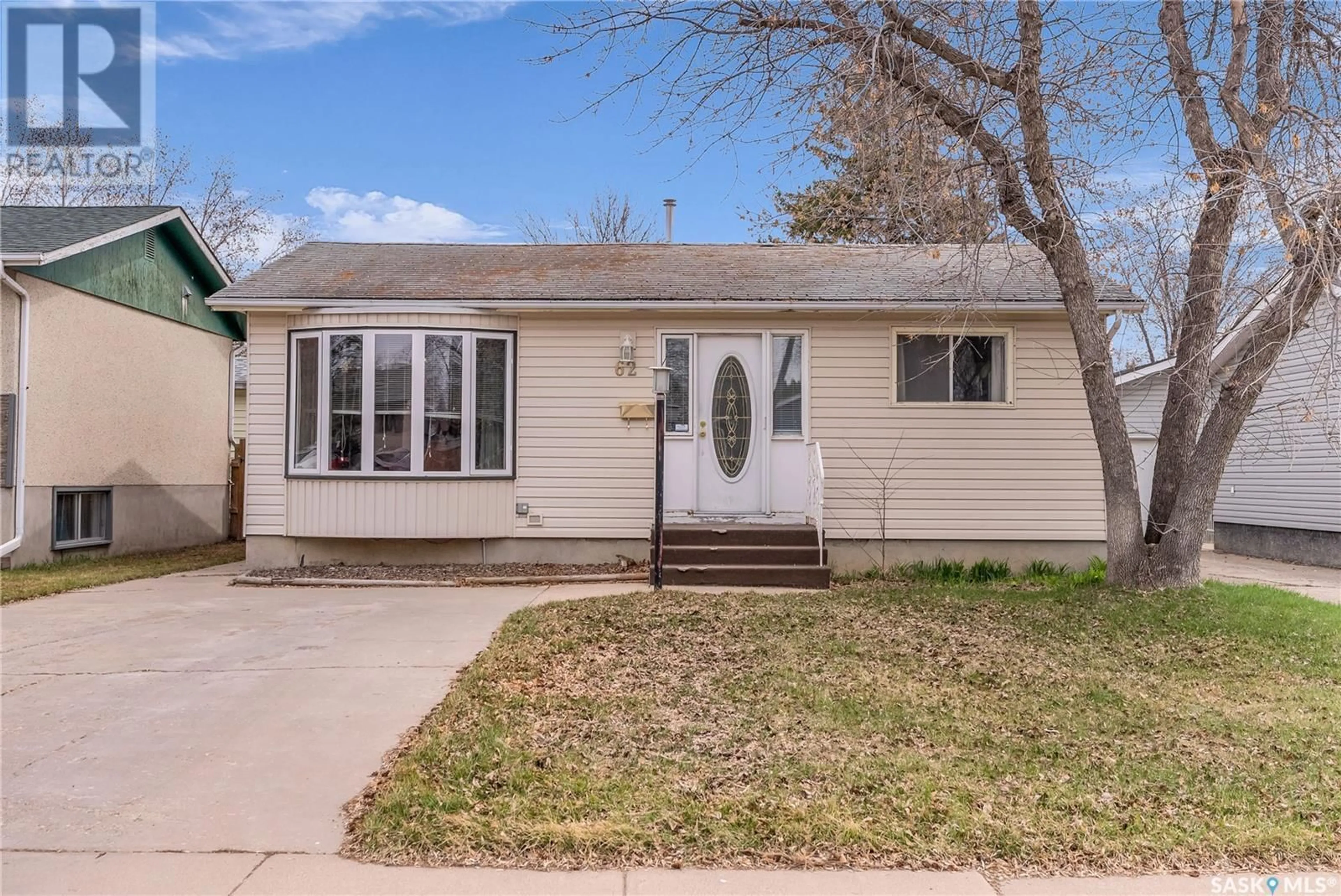 Home with vinyl exterior material, street for 62 MAXWELL CRESCENT, Saskatoon Saskatchewan S7L3Y2