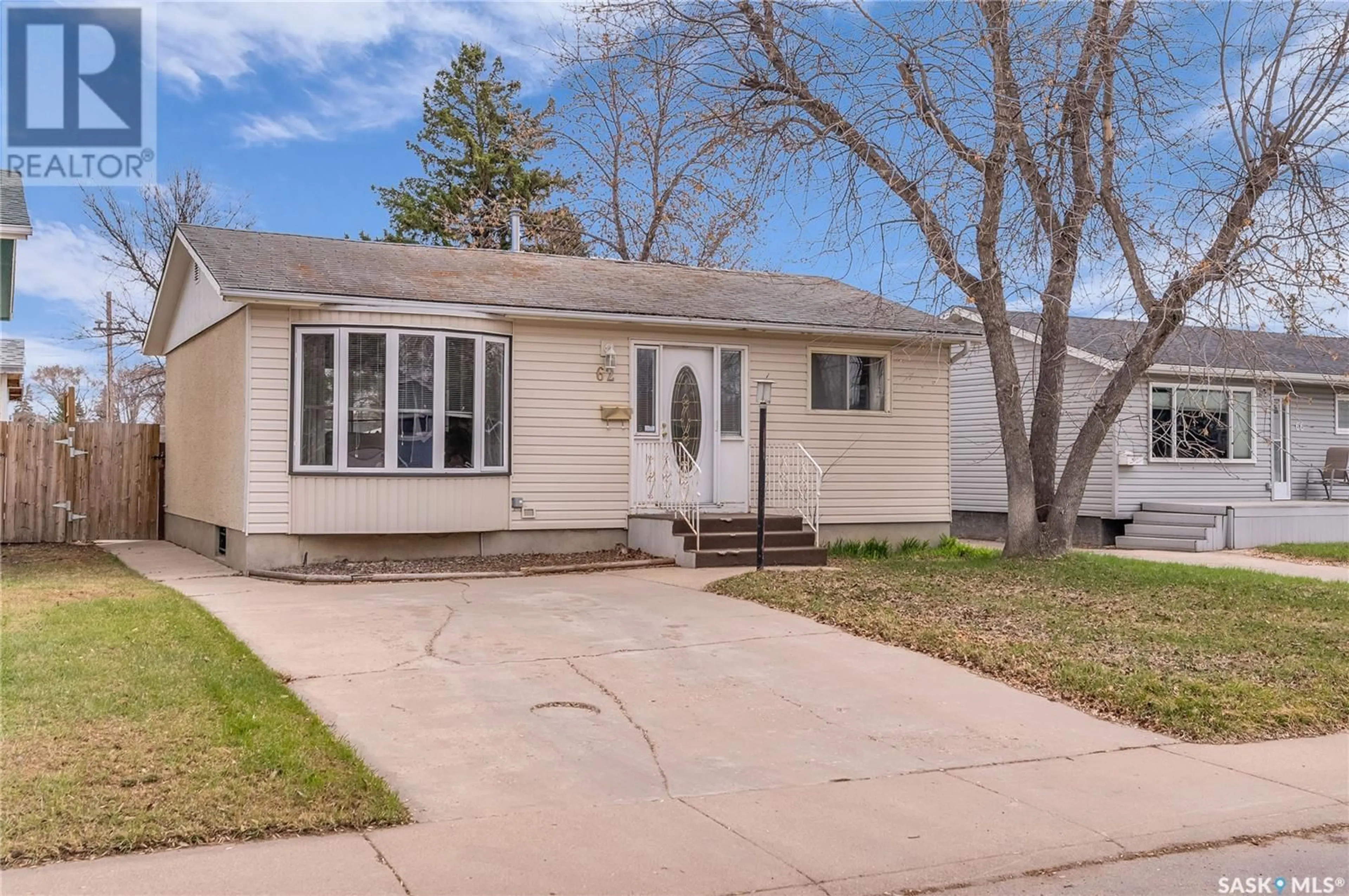Home with vinyl exterior material, street for 62 MAXWELL CRESCENT, Saskatoon Saskatchewan S7L3Y2
