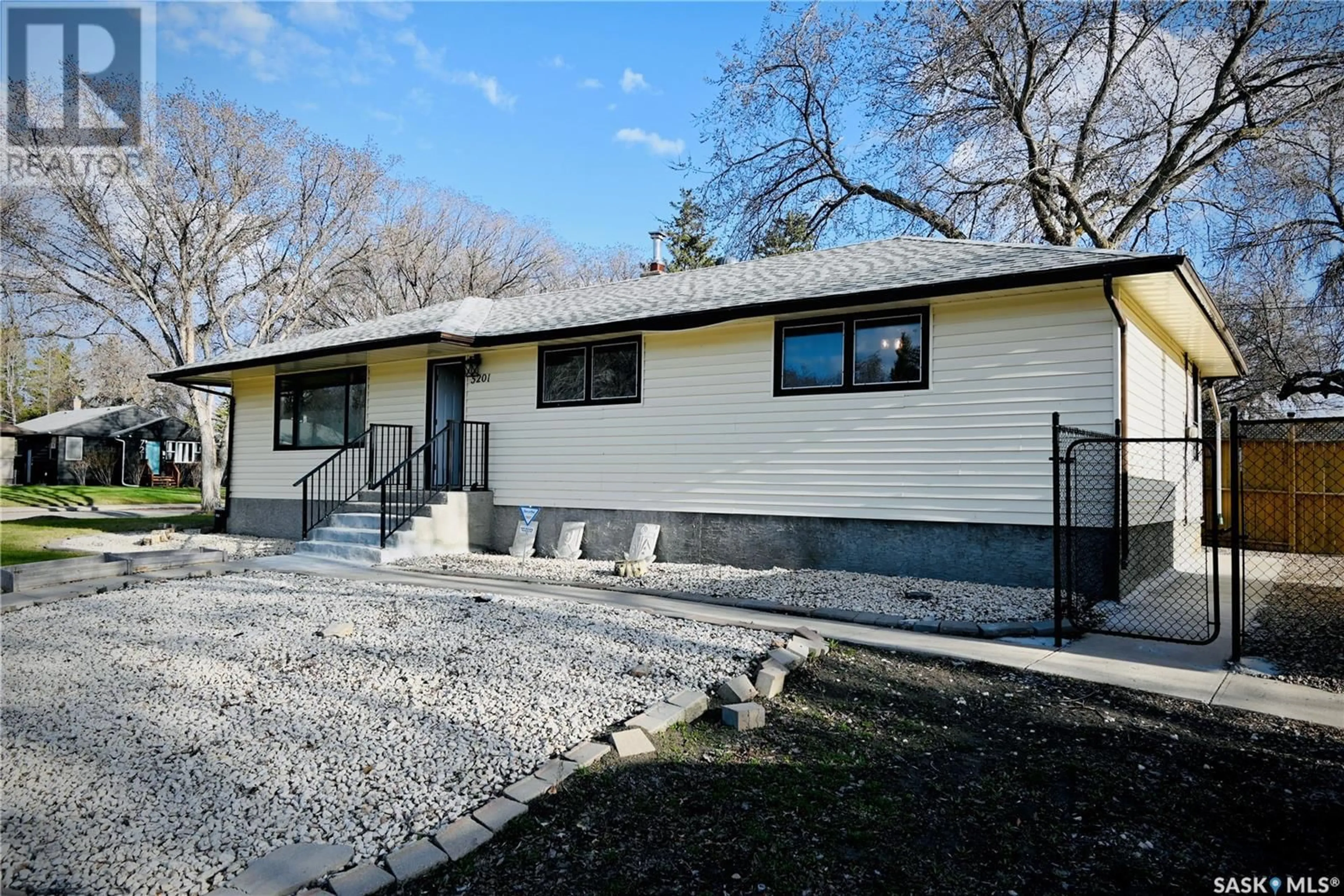Home with vinyl exterior material, street for 5201 1ST AVENUE, Regina Saskatchewan S4T0A7