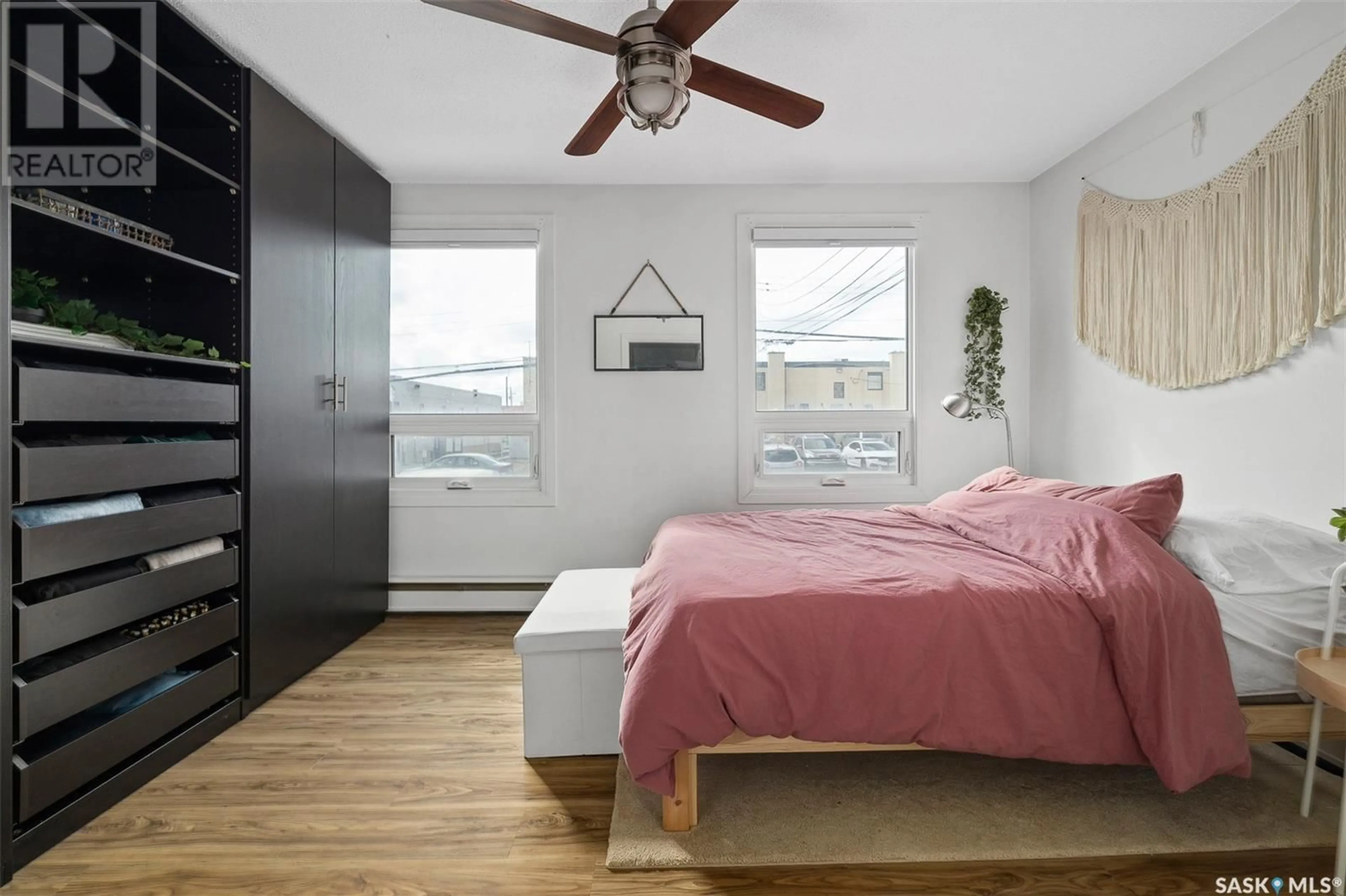 Bedroom with bed, wood/laminate floor for N - 205 415 3RD AVENUE, Saskatoon Saskatchewan S7J2J2