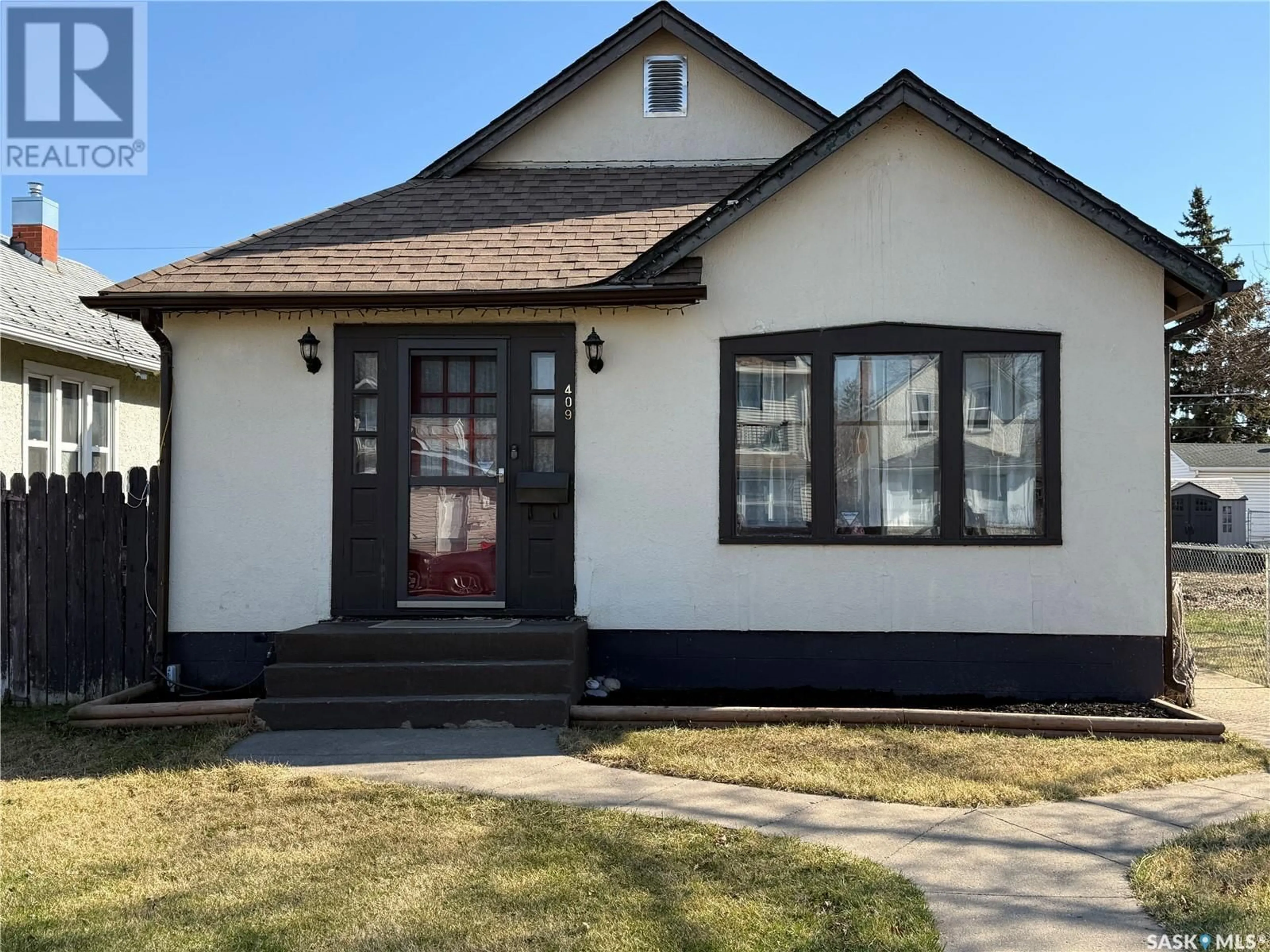 Home with vinyl exterior material, street for 409 12TH STREET, Prince Albert Saskatchewan S6V1C3