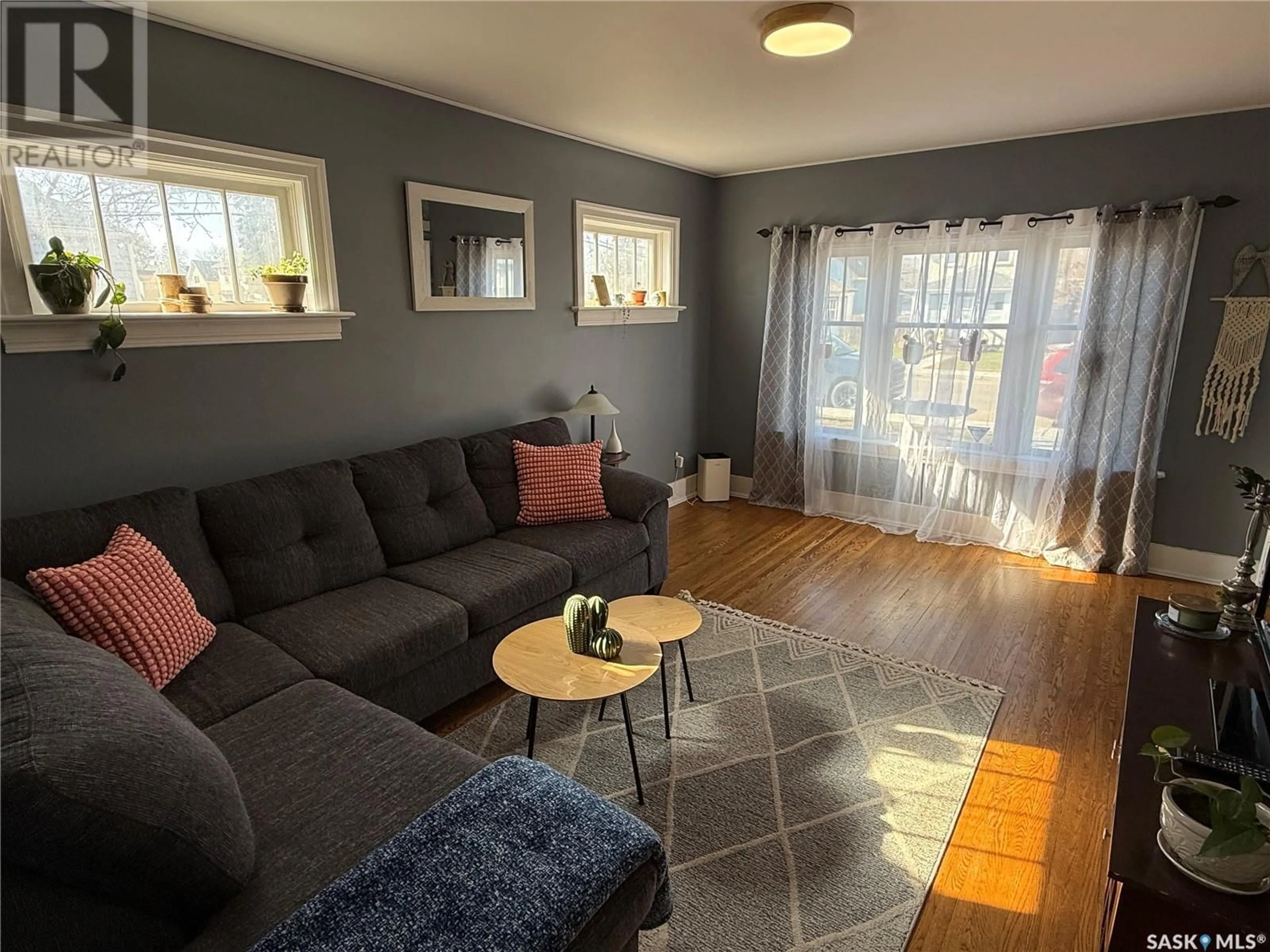 Living room with furniture, wood/laminate floor for 409 12TH STREET, Prince Albert Saskatchewan S6V1C3