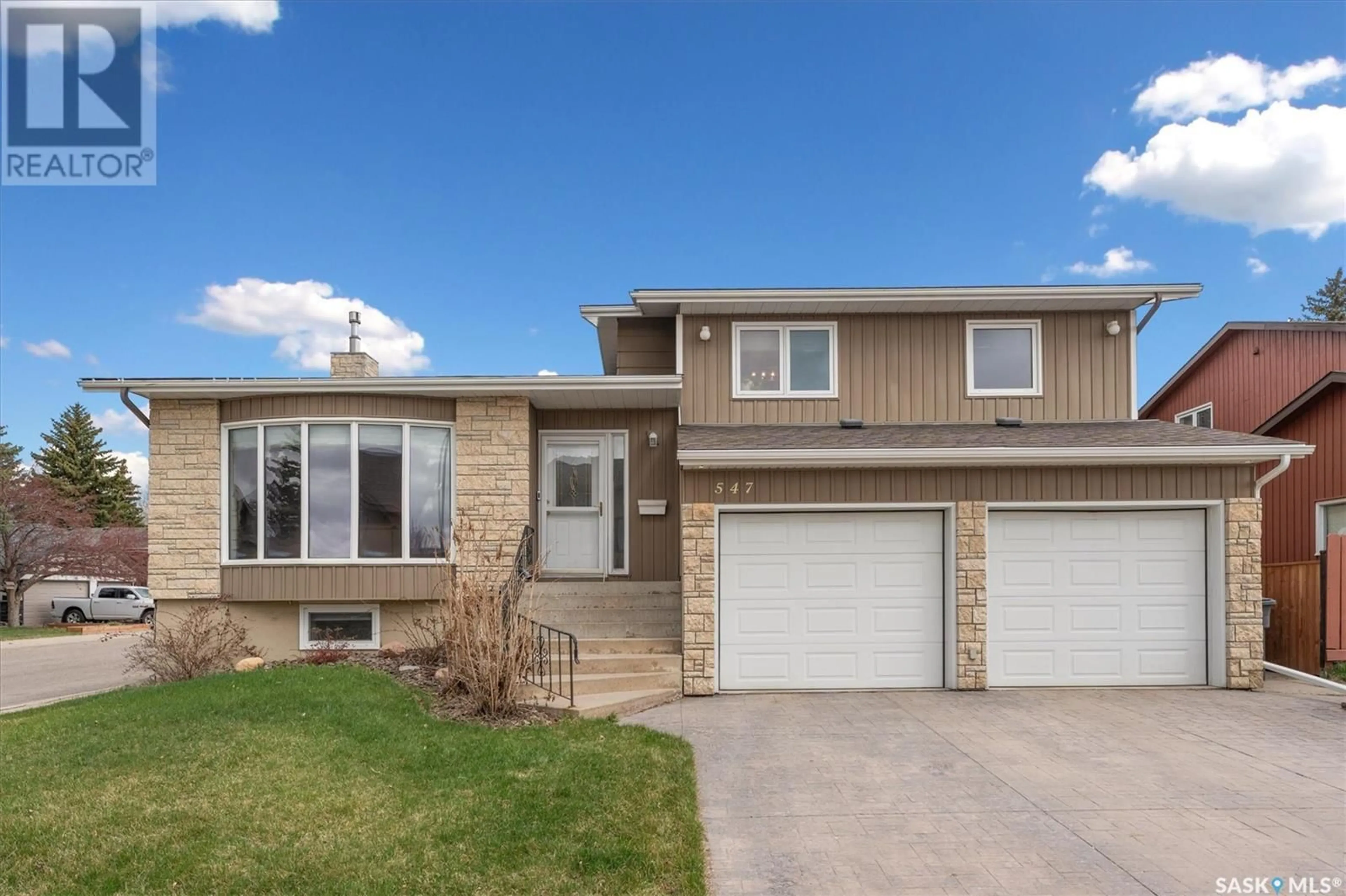 Home with vinyl exterior material, street for 547 CHRISTOPHER LANE, Saskatoon Saskatchewan S7J3S4