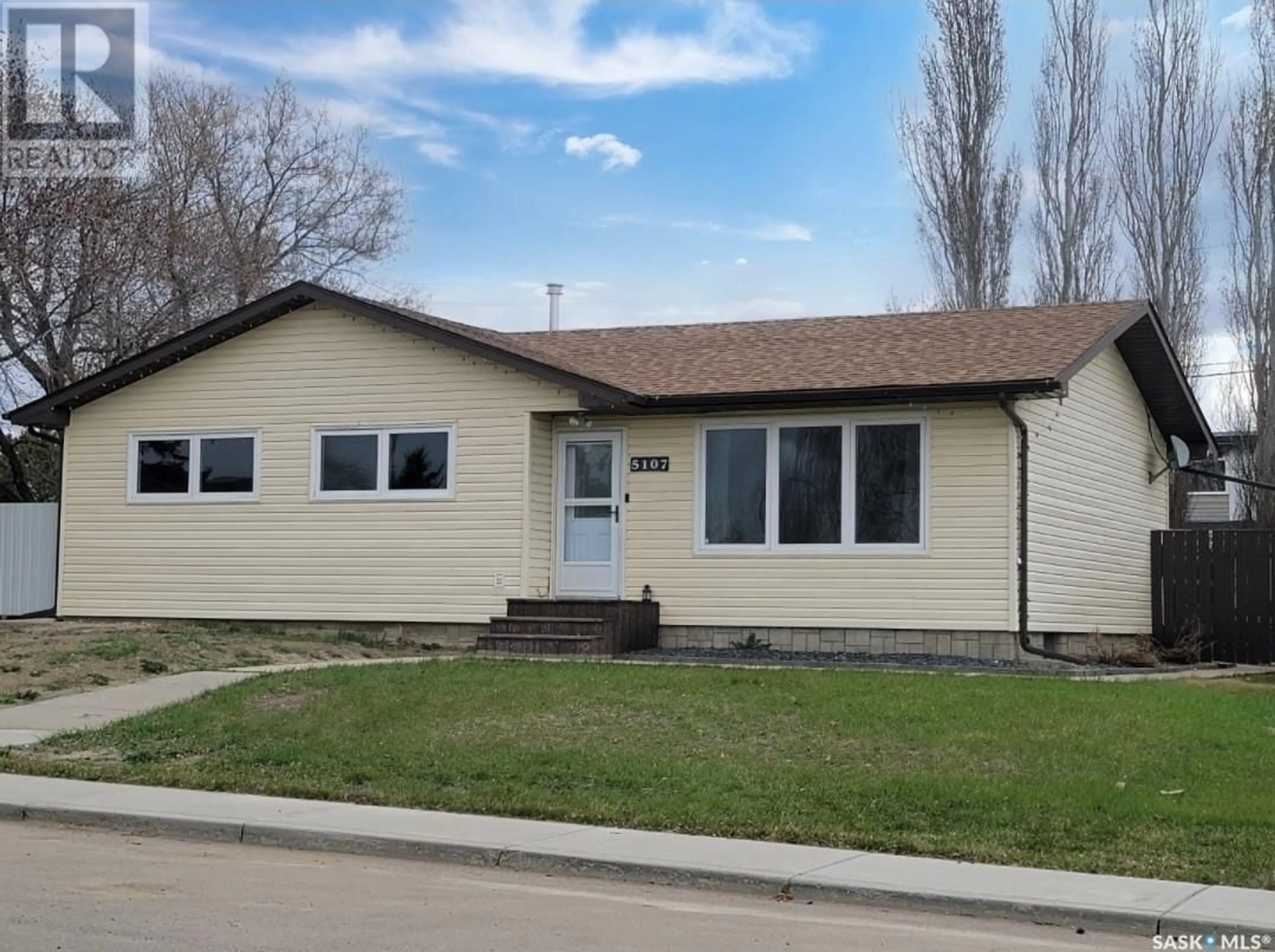 Home with vinyl exterior material, street for 5107 LEADER STREET, Macklin Saskatchewan S0L2C0