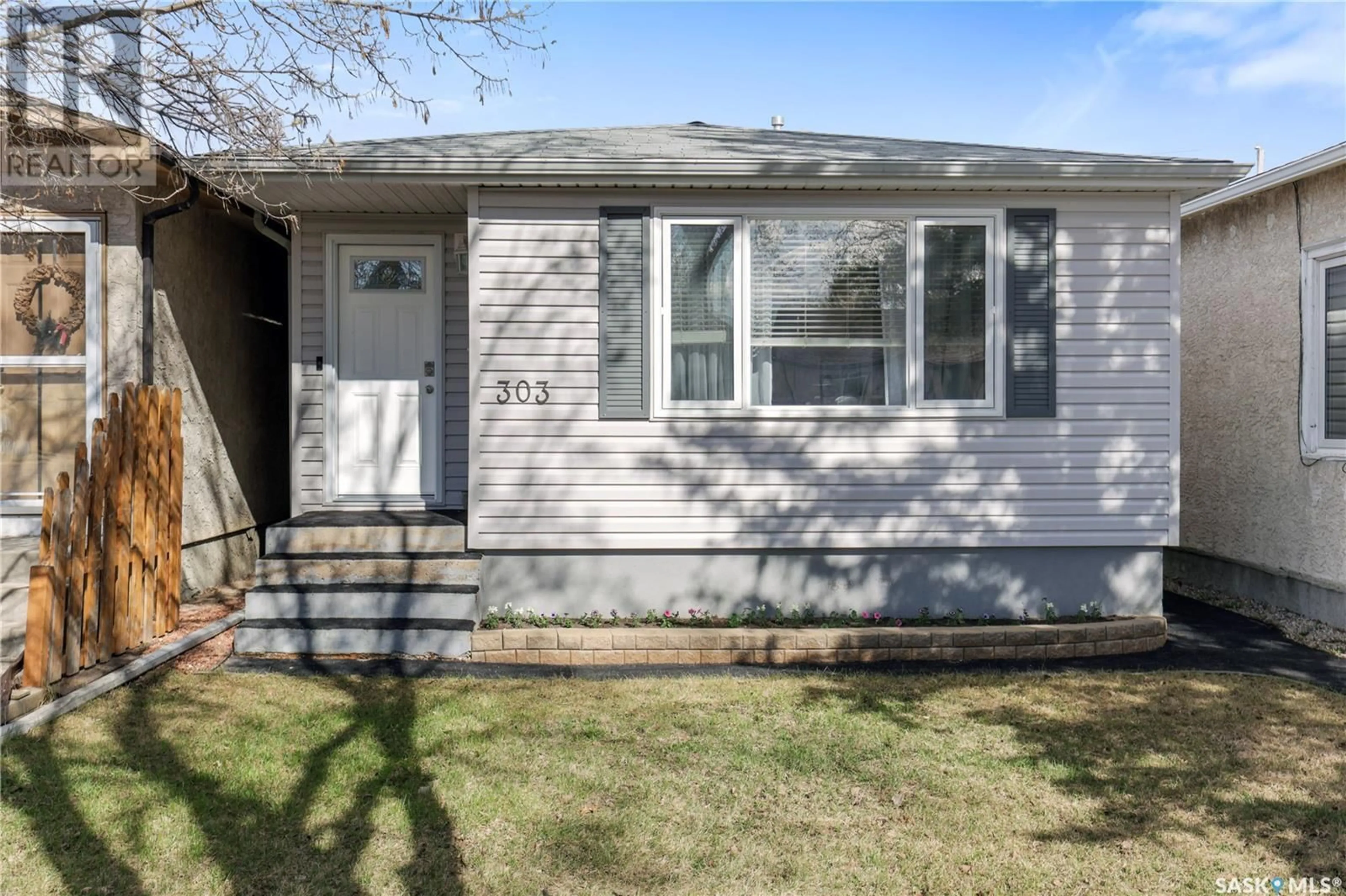 Home with vinyl exterior material, street for 303 TORONTO STREET, Regina Saskatchewan S4R1M3