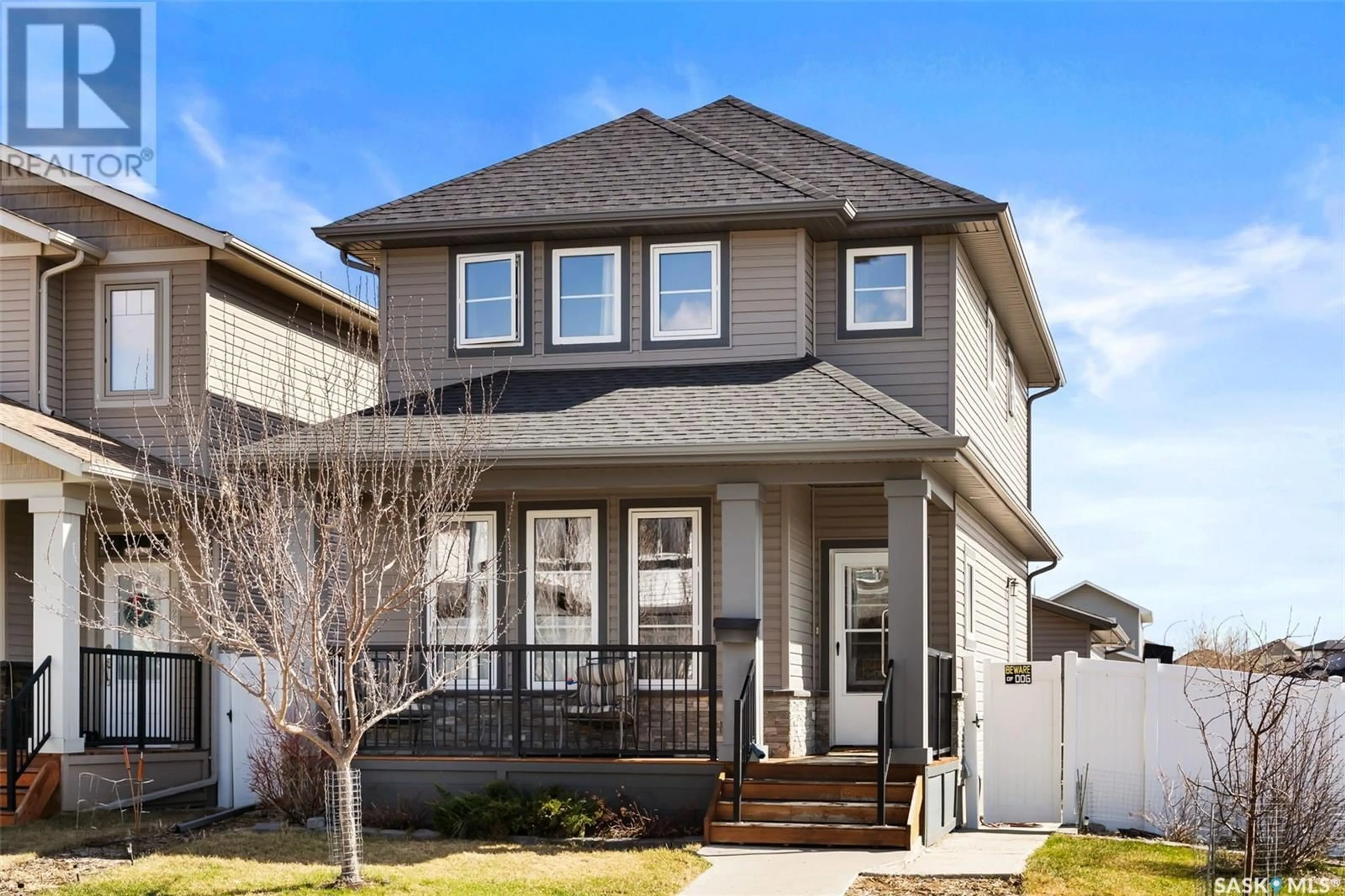 Home with vinyl exterior material, street for 7525 OXBOW WAY, Regina Saskatchewan S4Y0B5