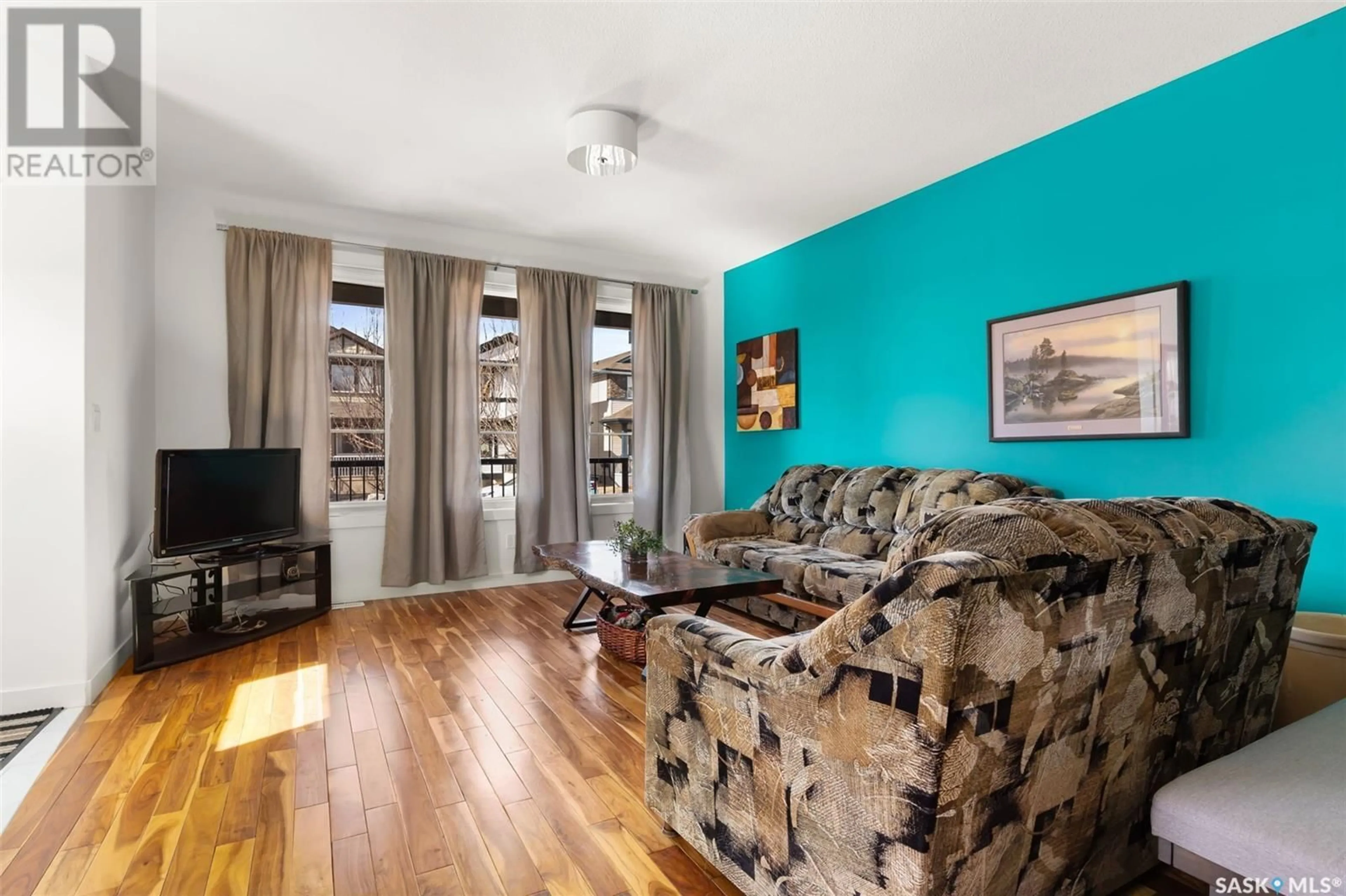 Living room with furniture, unknown for 7525 OXBOW WAY, Regina Saskatchewan S4Y0B5