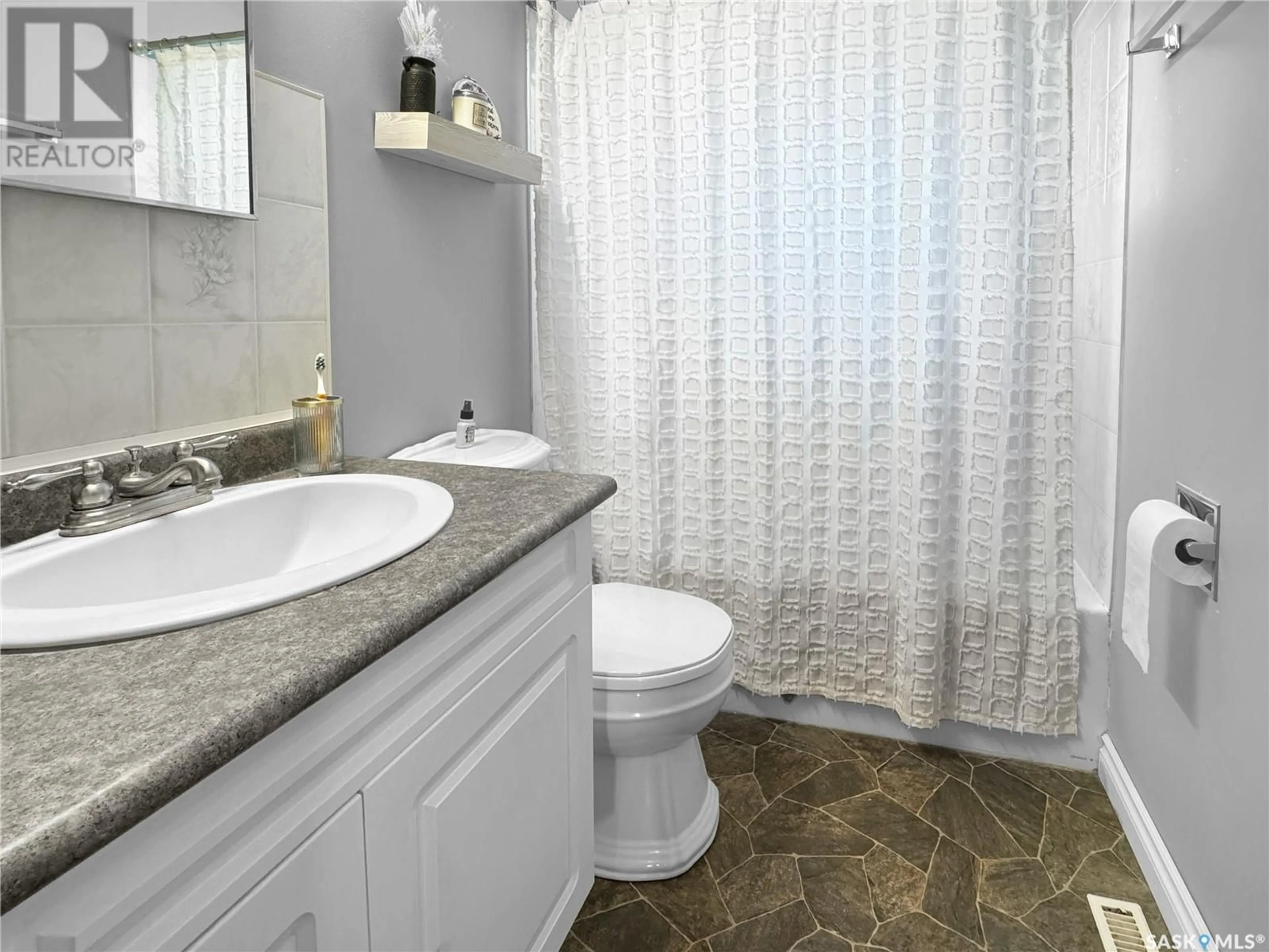 Standard bathroom, ceramic/tile floor for 1851 103RD STREET, North Battleford Saskatchewan S9A1M1