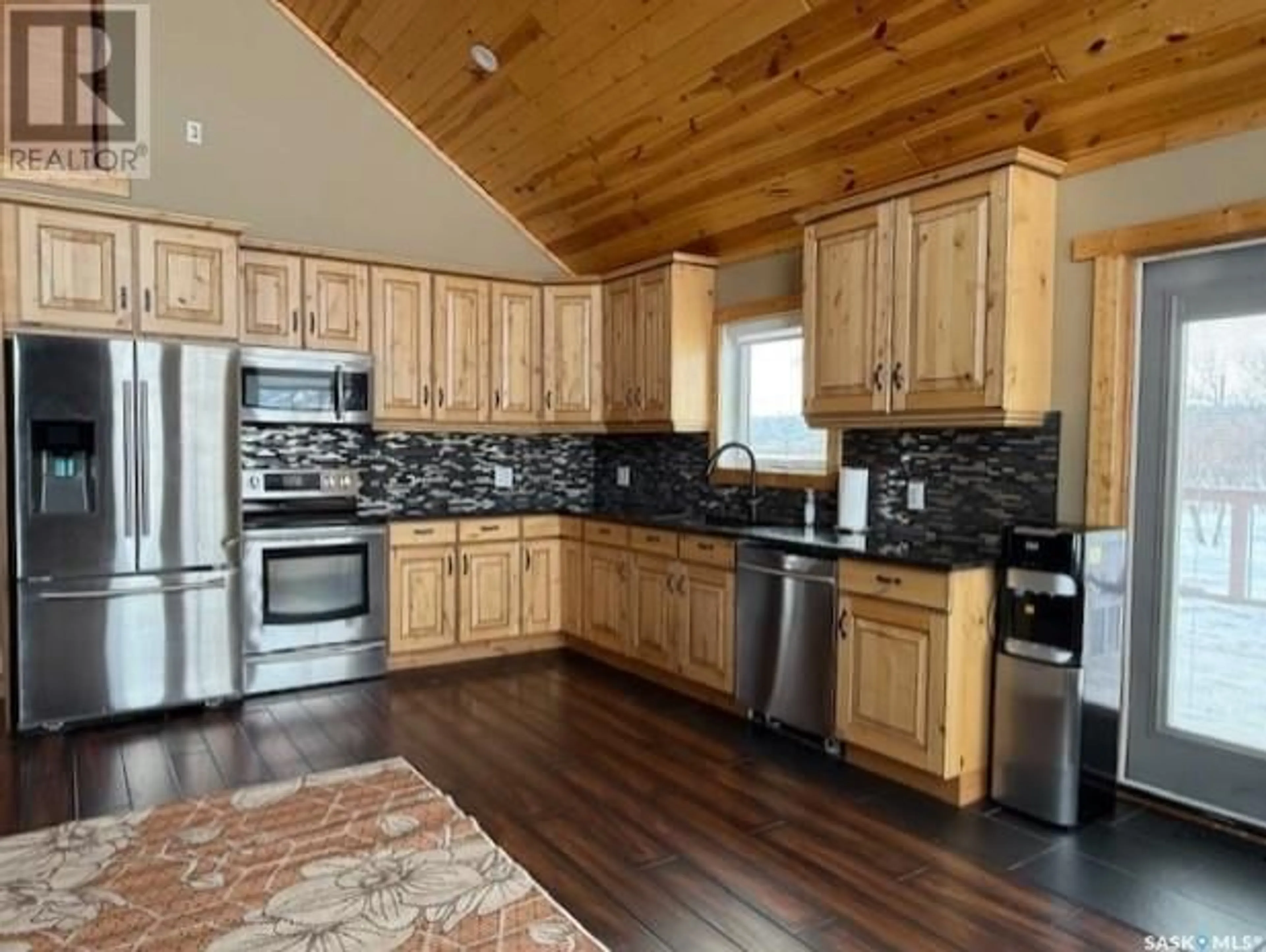 Open concept kitchen, wood/laminate floor for 152 CRIDDLE AVENUE, Crooked Lake Saskatchewan S0G5L0