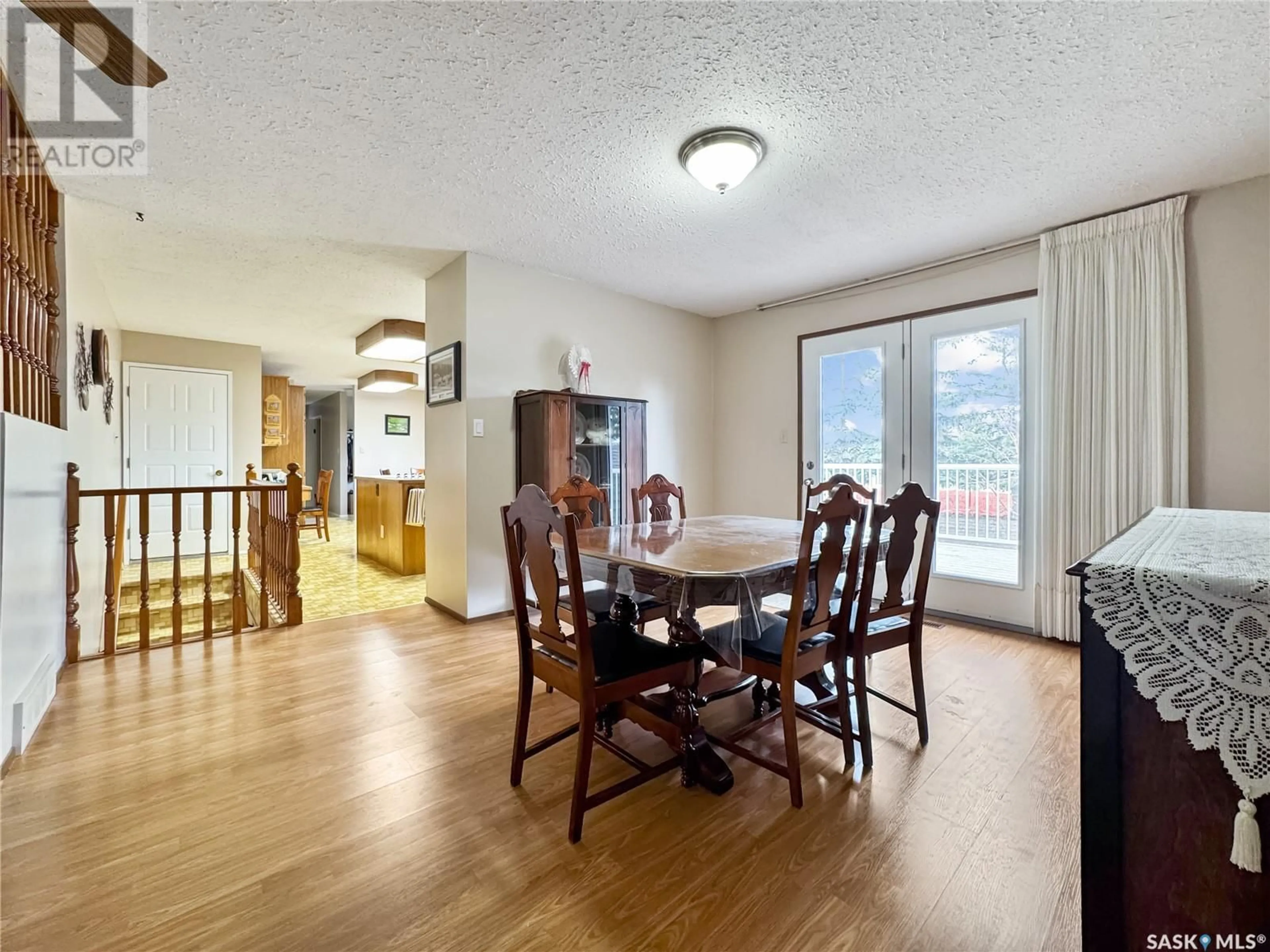 Dining room, wood/laminate floor for 113 RAILWAY AVENUE, Cut Knife Saskatchewan S0M0N0