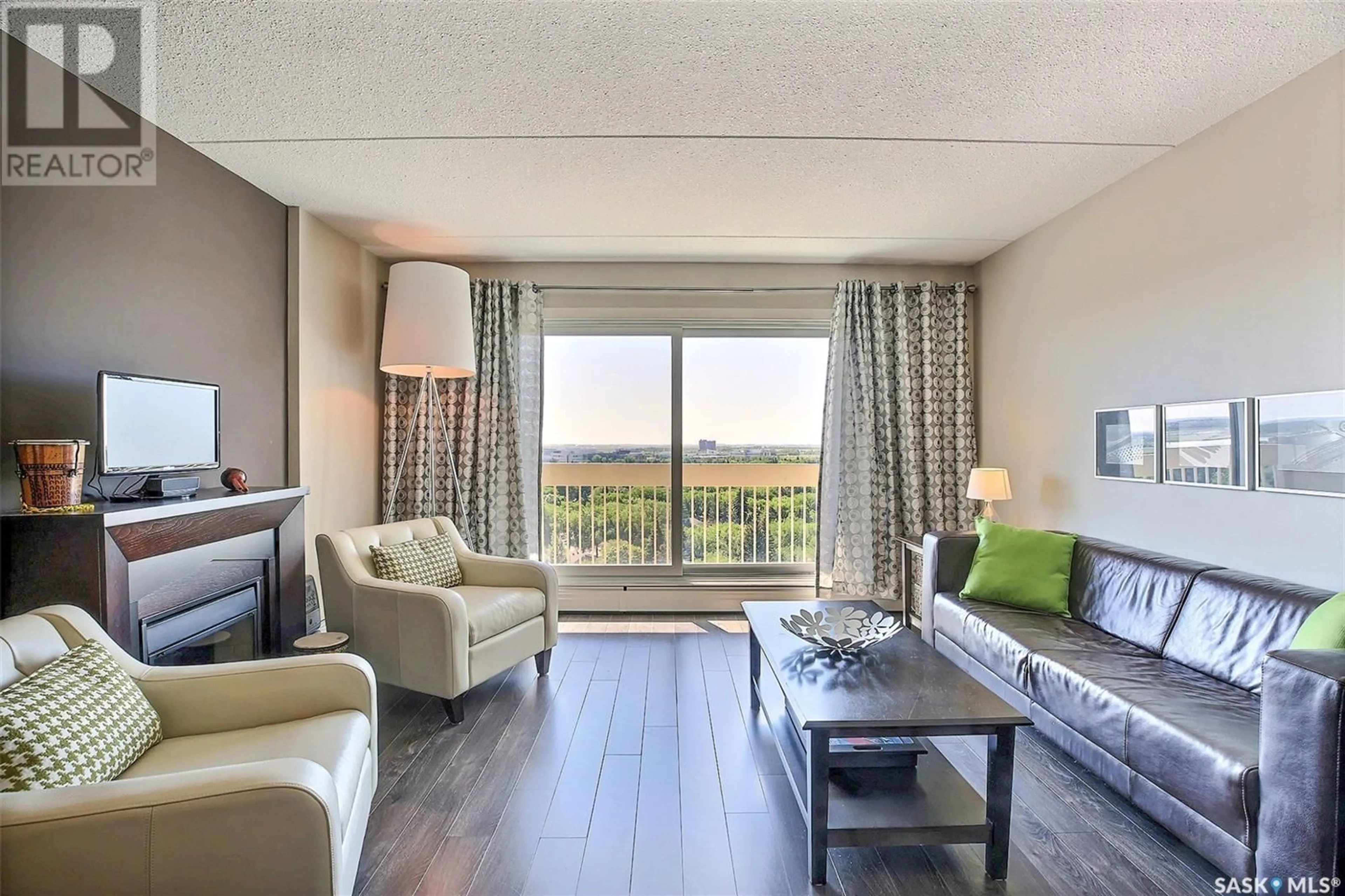Living room with furniture, wood/laminate floor for 3520 - 1506 HILLSDALE STREET, Regina Saskatchewan S4S5Z5
