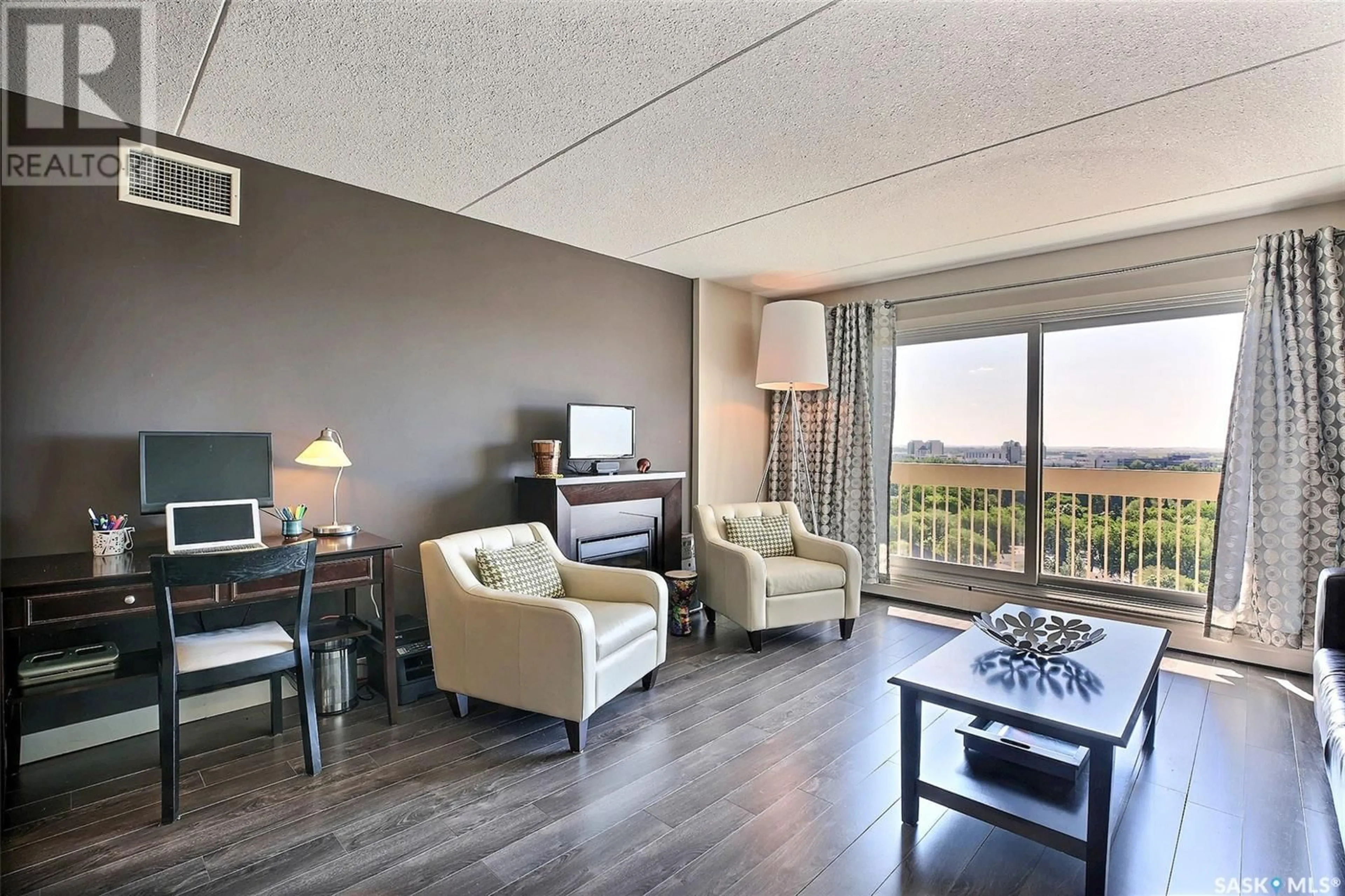 Living room with furniture, wood/laminate floor for 3520 - 1506 HILLSDALE STREET, Regina Saskatchewan S4S5Z5