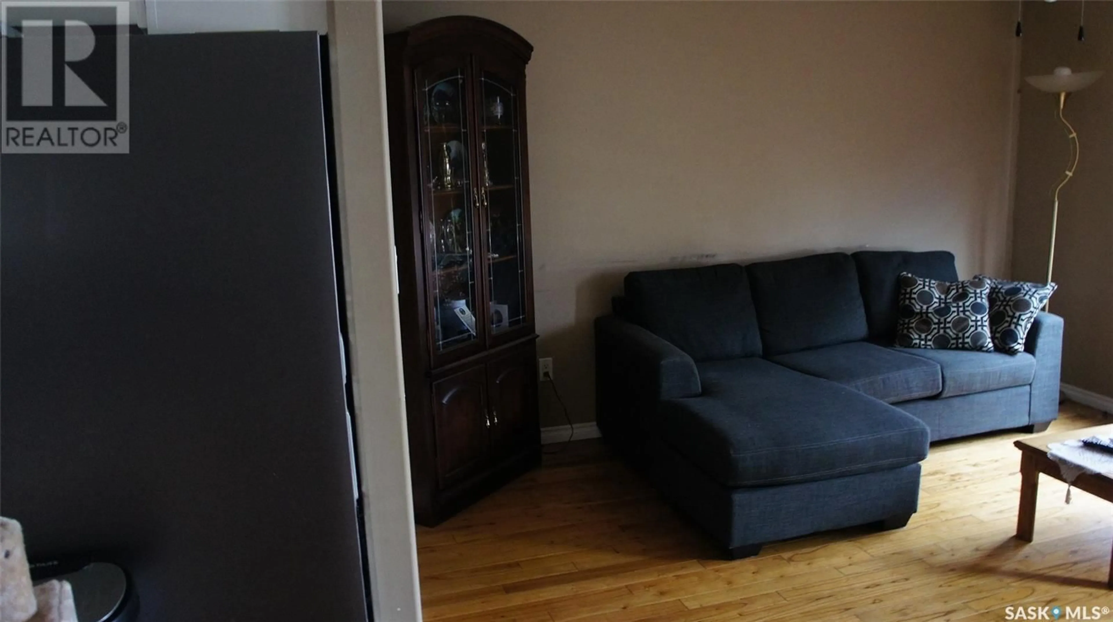 Living room with furniture, wood/laminate floor for 805 1ST STREET, Estevan Saskatchewan S4A0G2