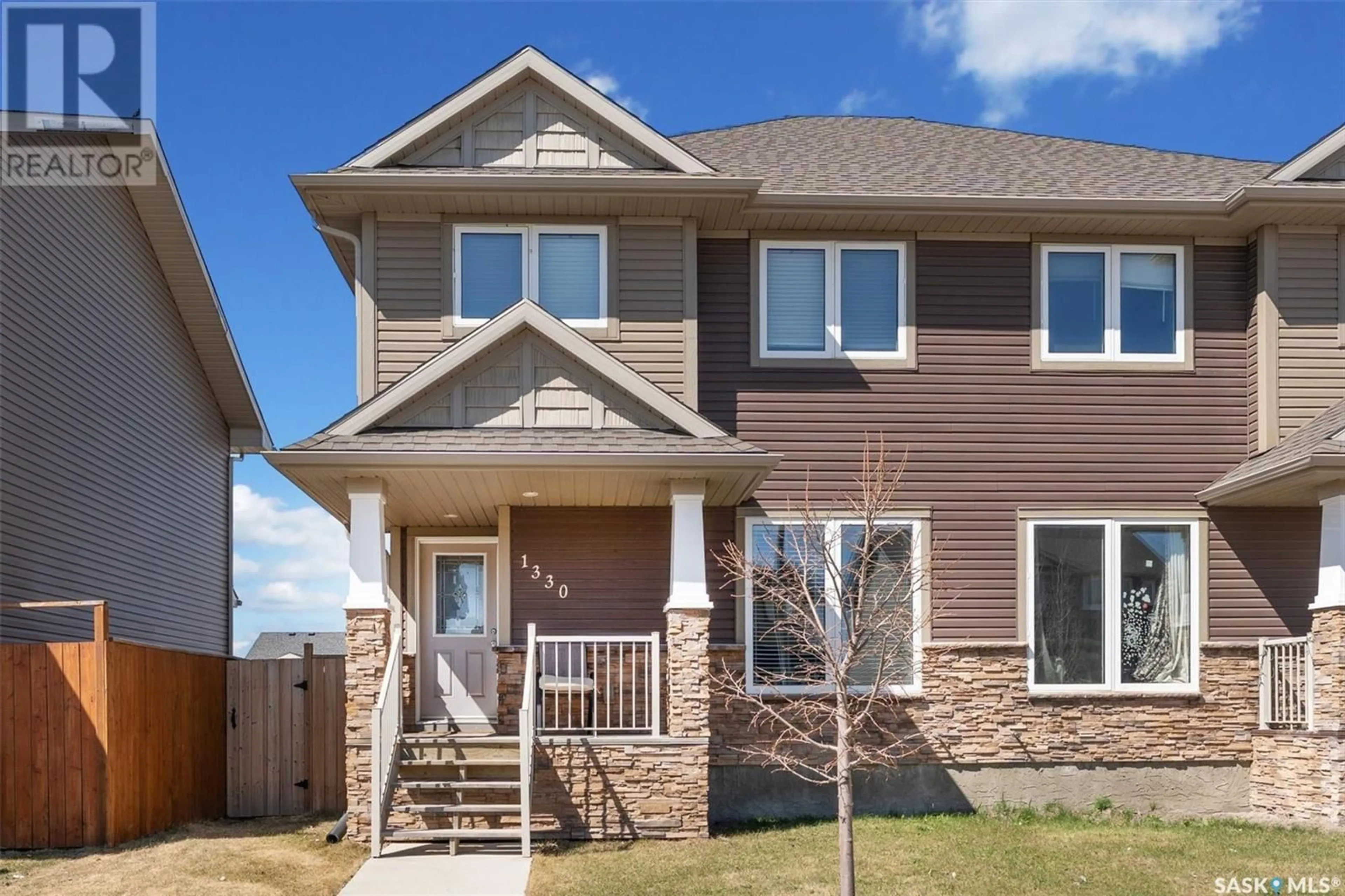 Home with vinyl exterior material, street for 1330 HUNTER ROAD, Saskatoon Saskatchewan S7T0S5