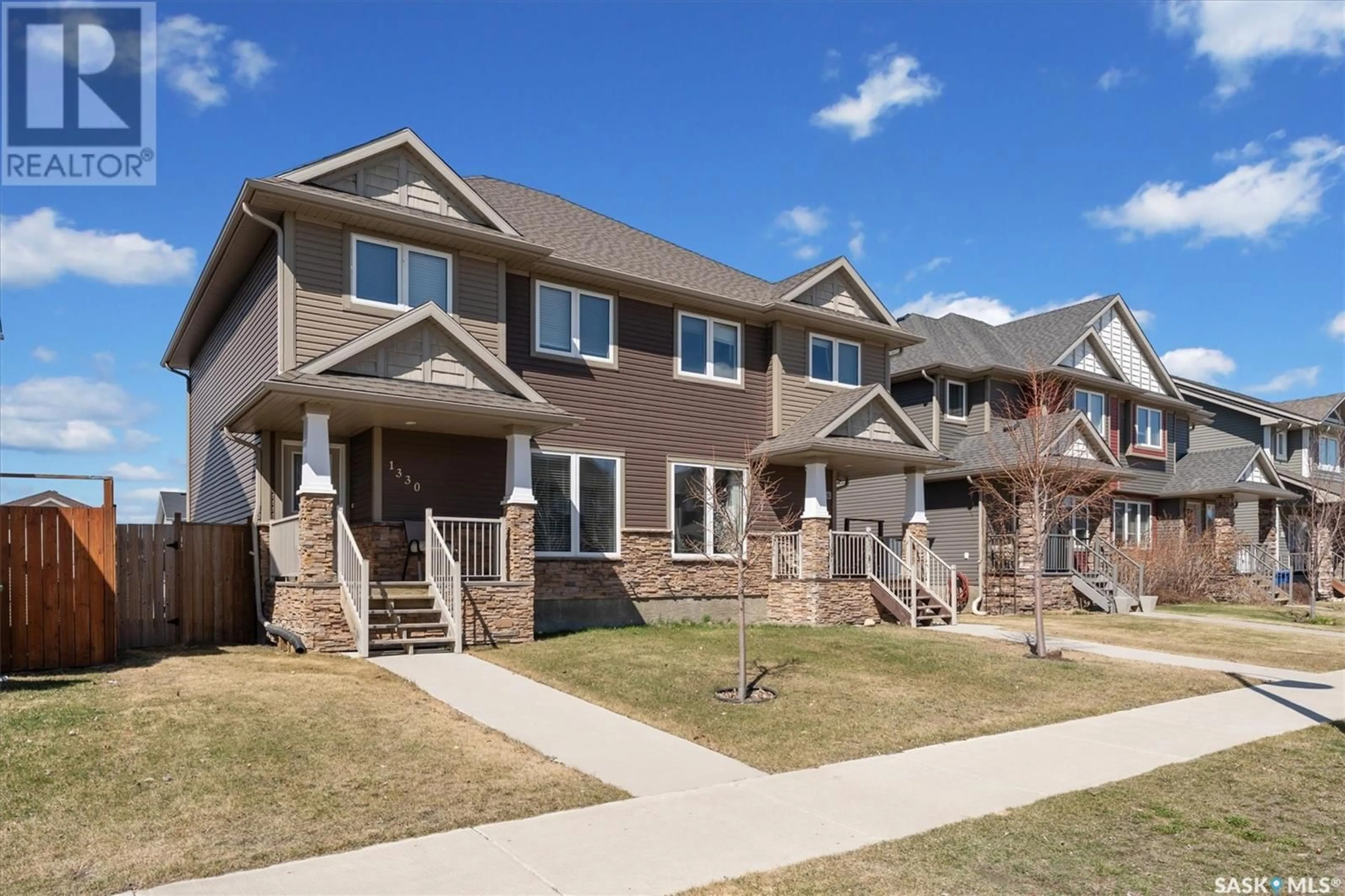 Home with vinyl exterior material, street for 1330 HUNTER ROAD, Saskatoon Saskatchewan S7T0S5