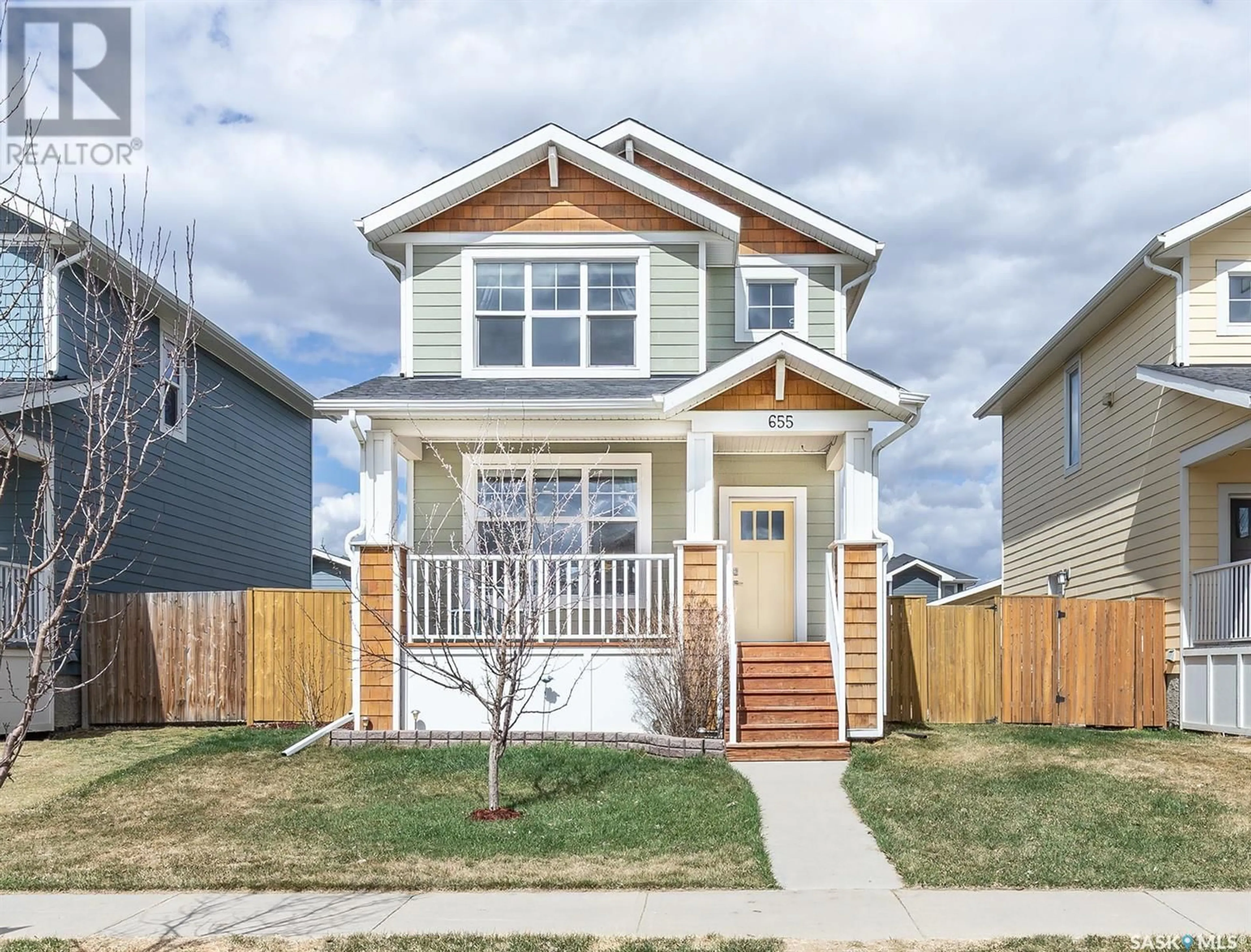 Home with vinyl exterior material, street for 655 MEADOWS BOULEVARD, Saskatoon Saskatchewan S7V0H5