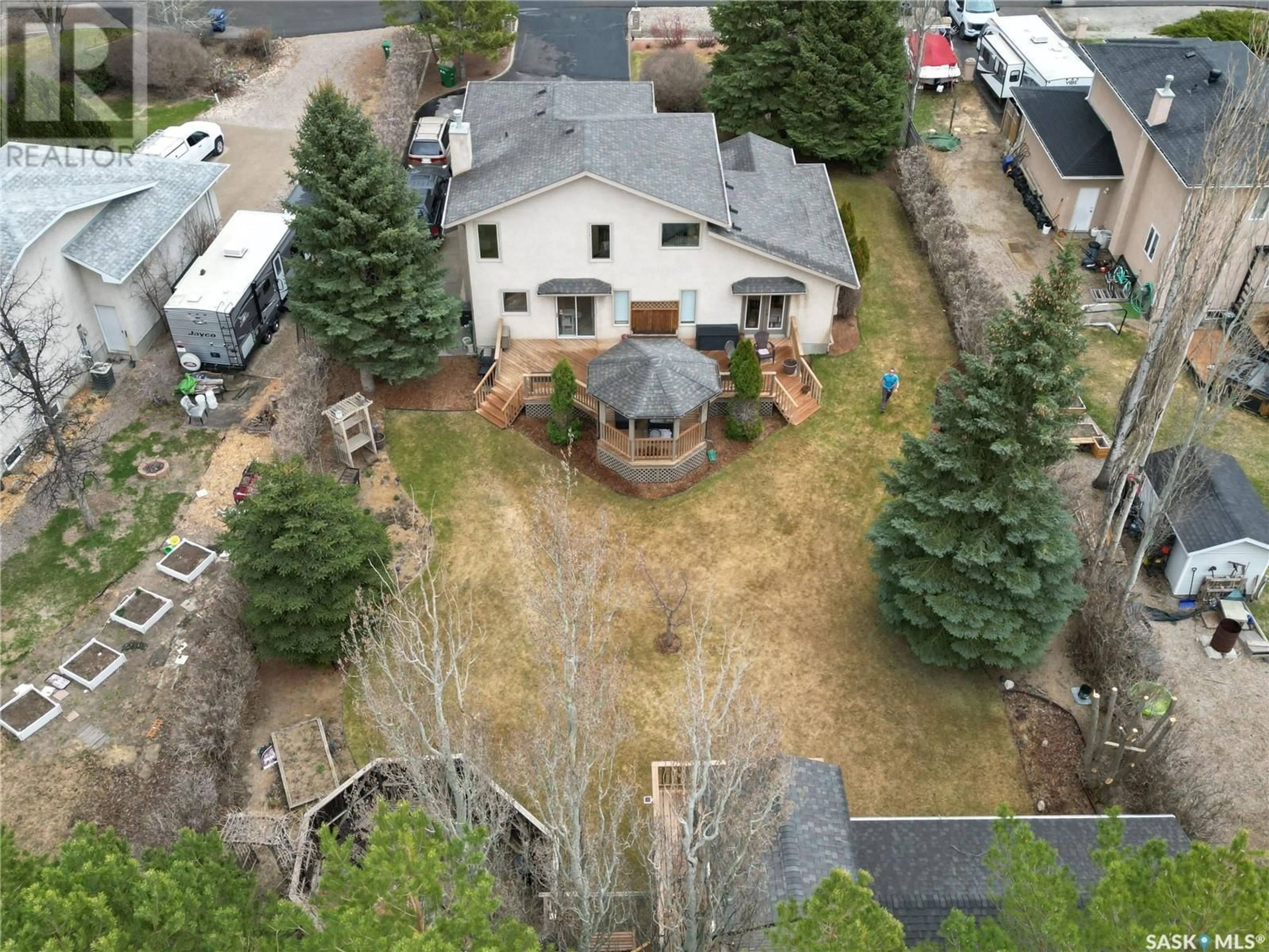 A pic from outside/outdoor area/front of a property/back of a property/a pic from drone, mountain view for 4 PARK BAY, Emerald Park Saskatchewan S4L1B2