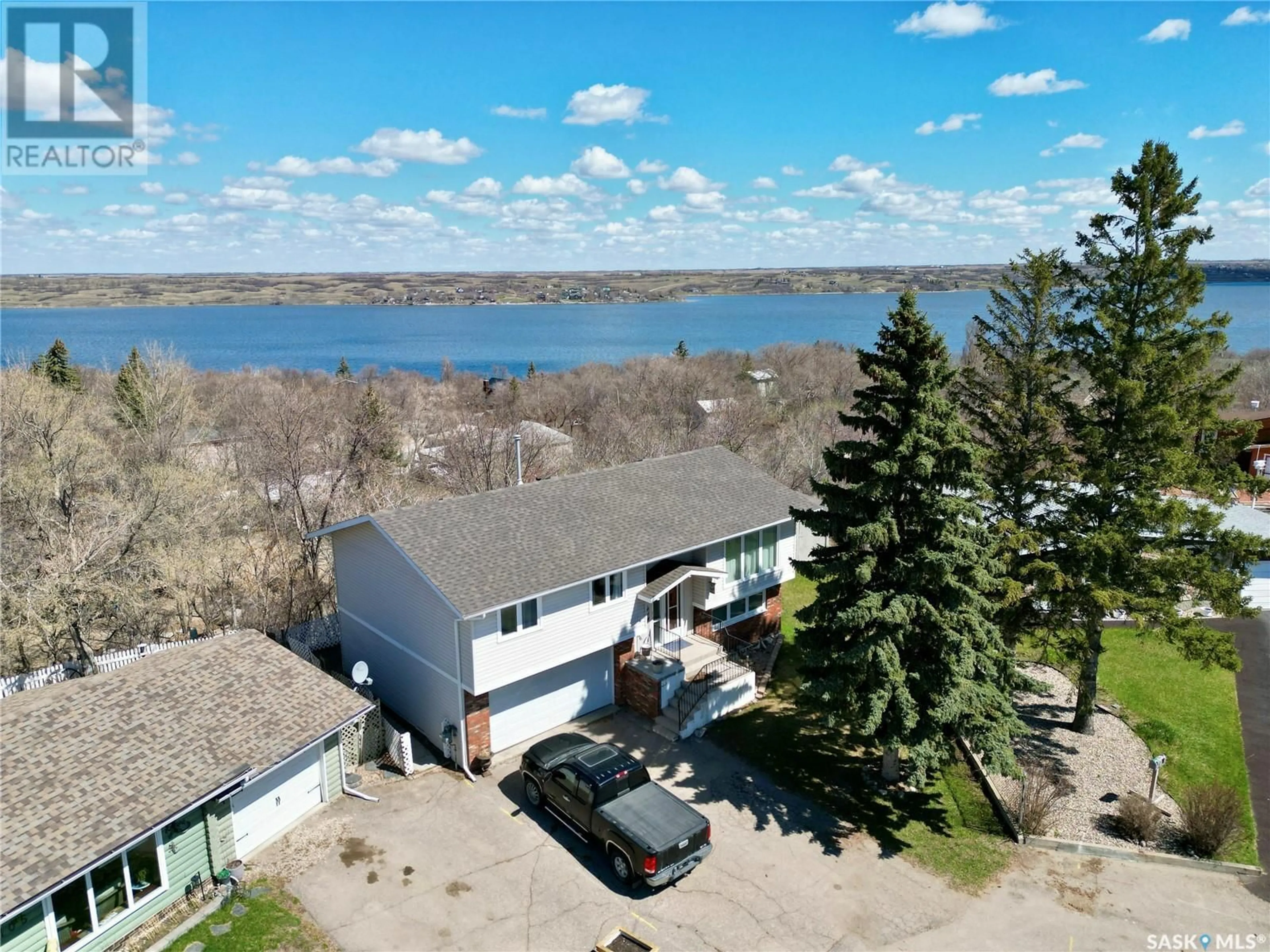 A pic from outside/outdoor area/front of a property/back of a property/a pic from drone, water/lake/river/ocean view for 106 BARBER PLACE, Regina Beach Saskatchewan S0G4C0