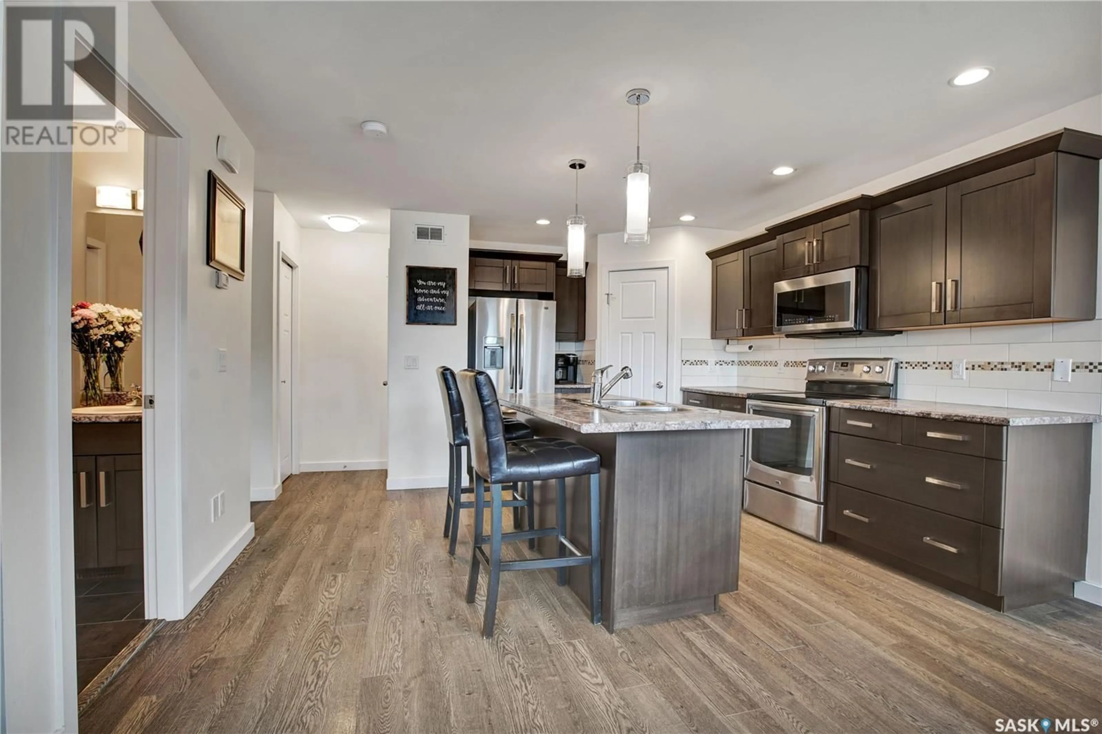 Open concept kitchen, wood/laminate floor for N - 1 38 2ND AVENUE, Martensville Saskatchewan S0K2T0