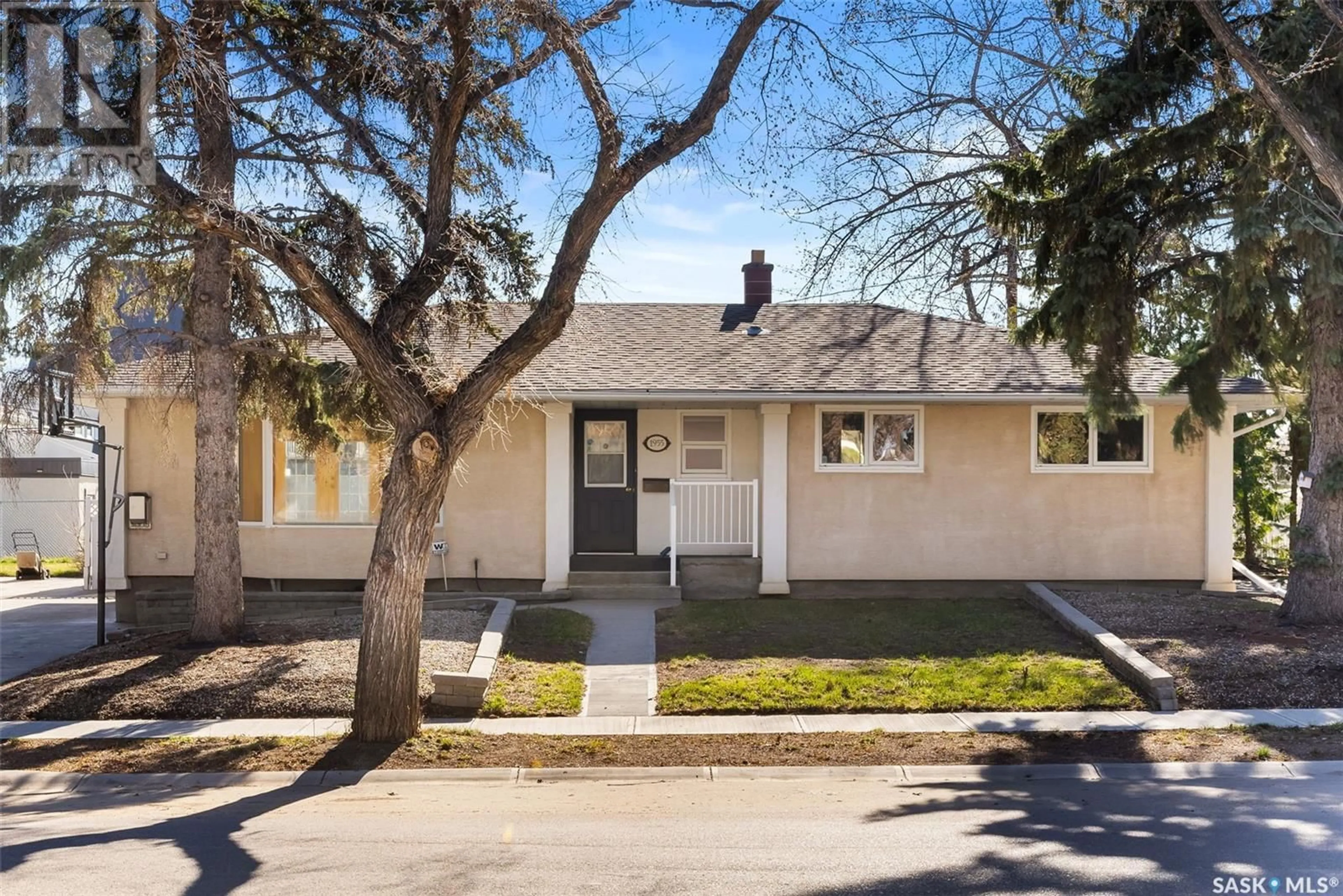 Home with vinyl exterior material, street for 1955 COWAN CRESCENT, Regina Saskatchewan S4S4C4