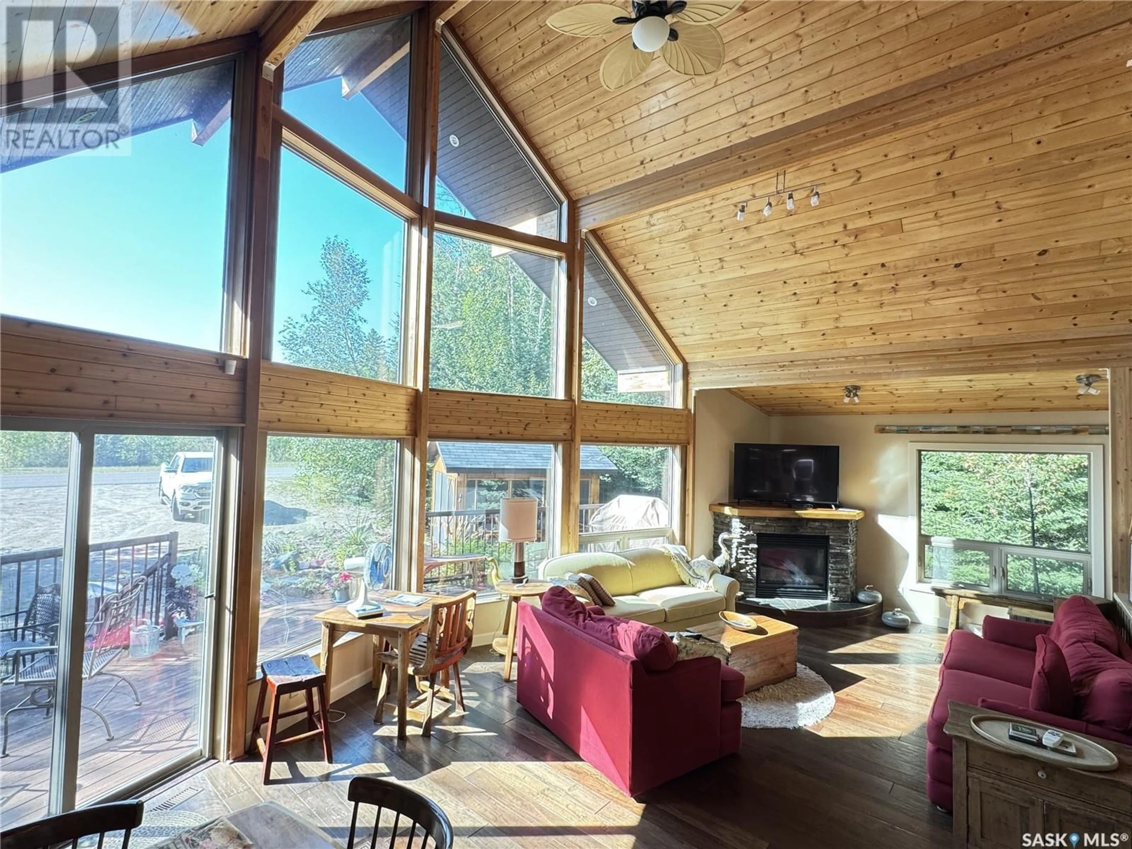 Living room with furniture, wood/laminate floor for 106 ESTATES DRIVE, Elk Ridge Saskatchewan S0J0N0