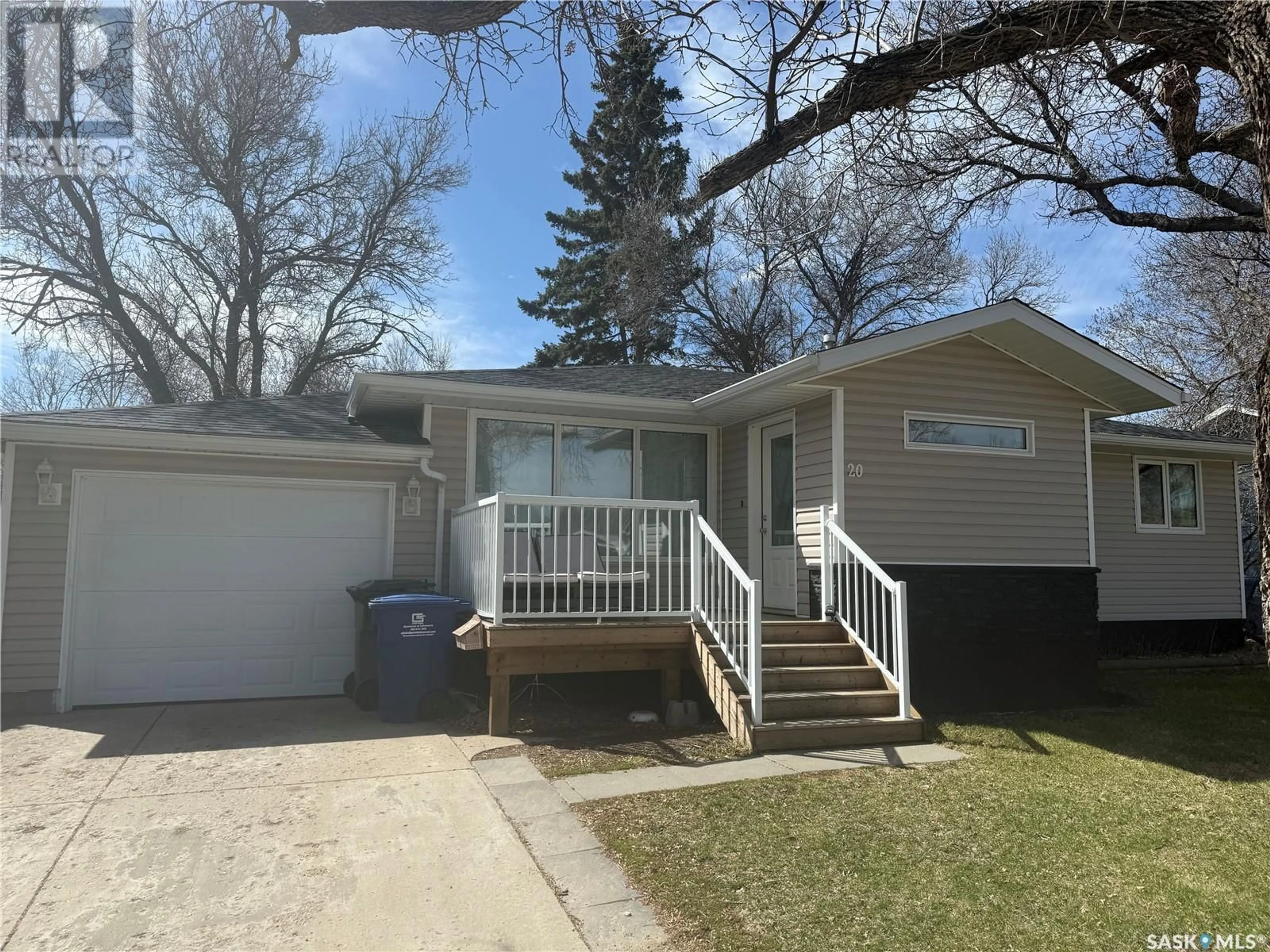 Home with vinyl exterior material, street for 20 SCOTT CRESCENT, Weyburn Saskatchewan S4H1T6