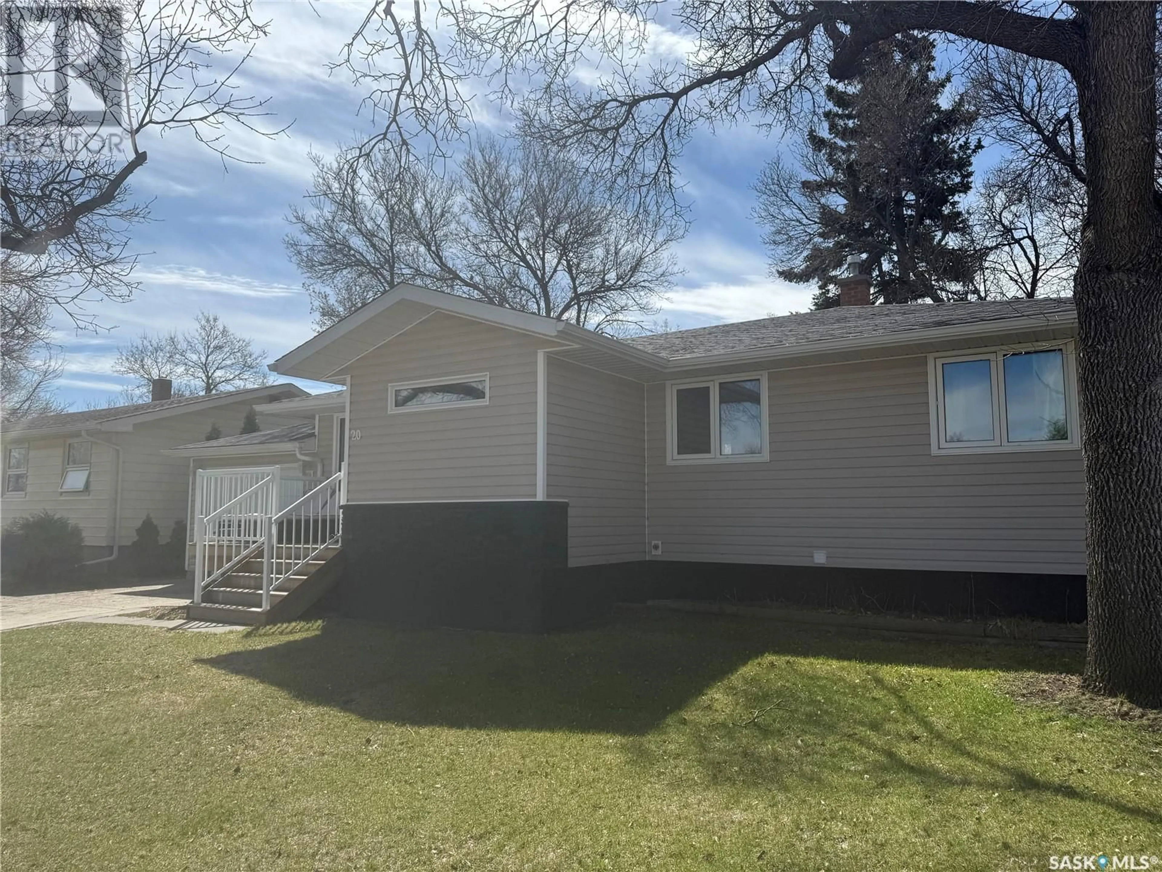 Home with vinyl exterior material, street for 20 SCOTT CRESCENT, Weyburn Saskatchewan S4H1T6