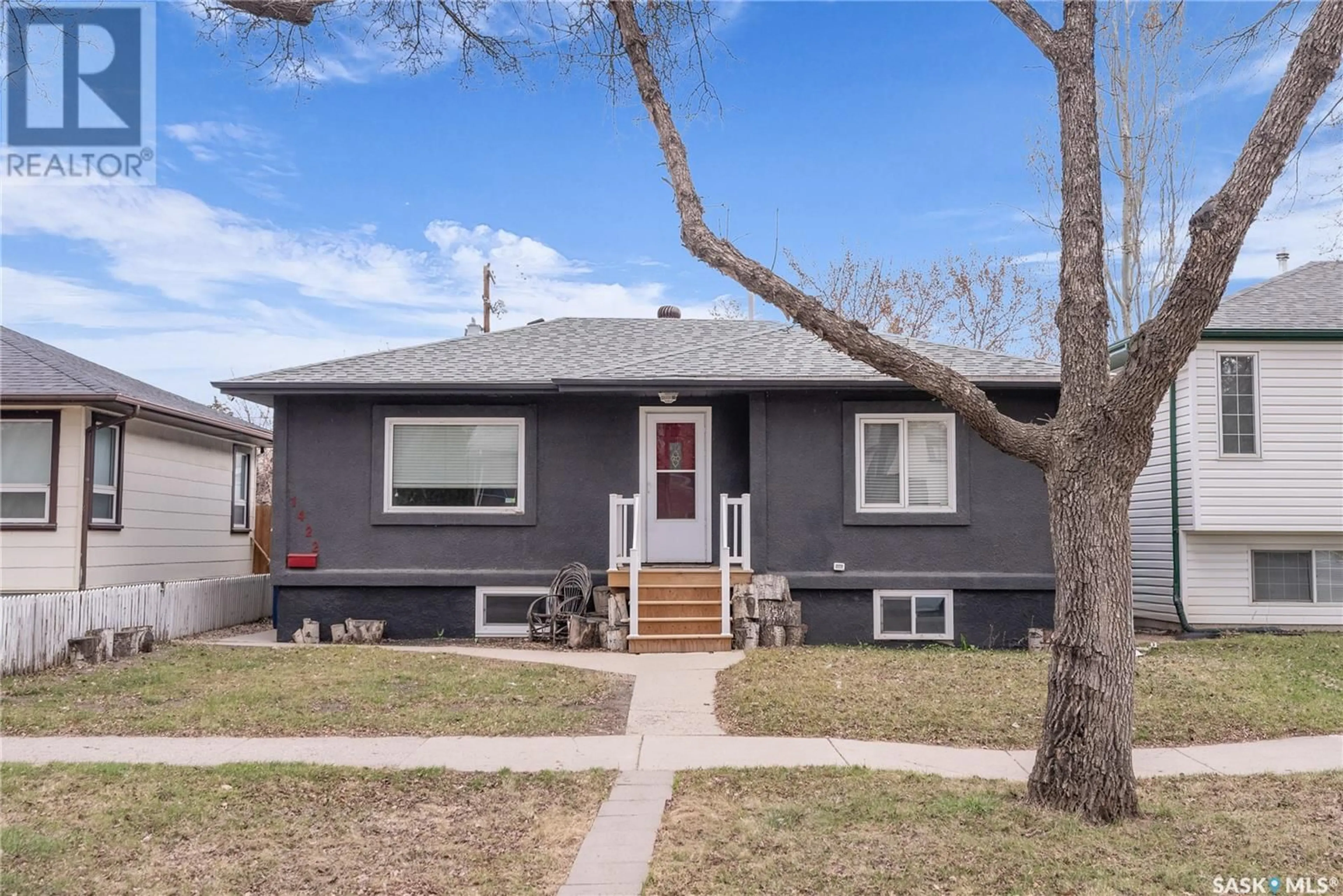 Home with vinyl exterior material, street for 1422 B AVENUE, Saskatoon Saskatchewan S7L1G8