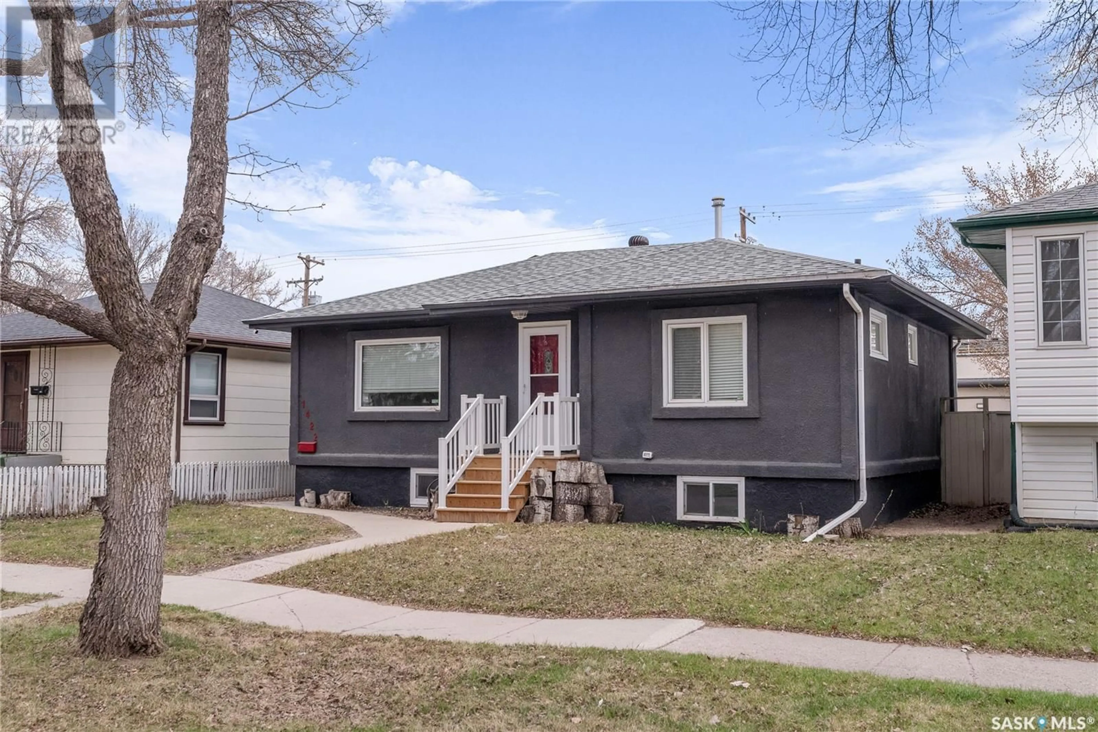 Home with vinyl exterior material, street for 1422 B AVENUE, Saskatoon Saskatchewan S7L1G8