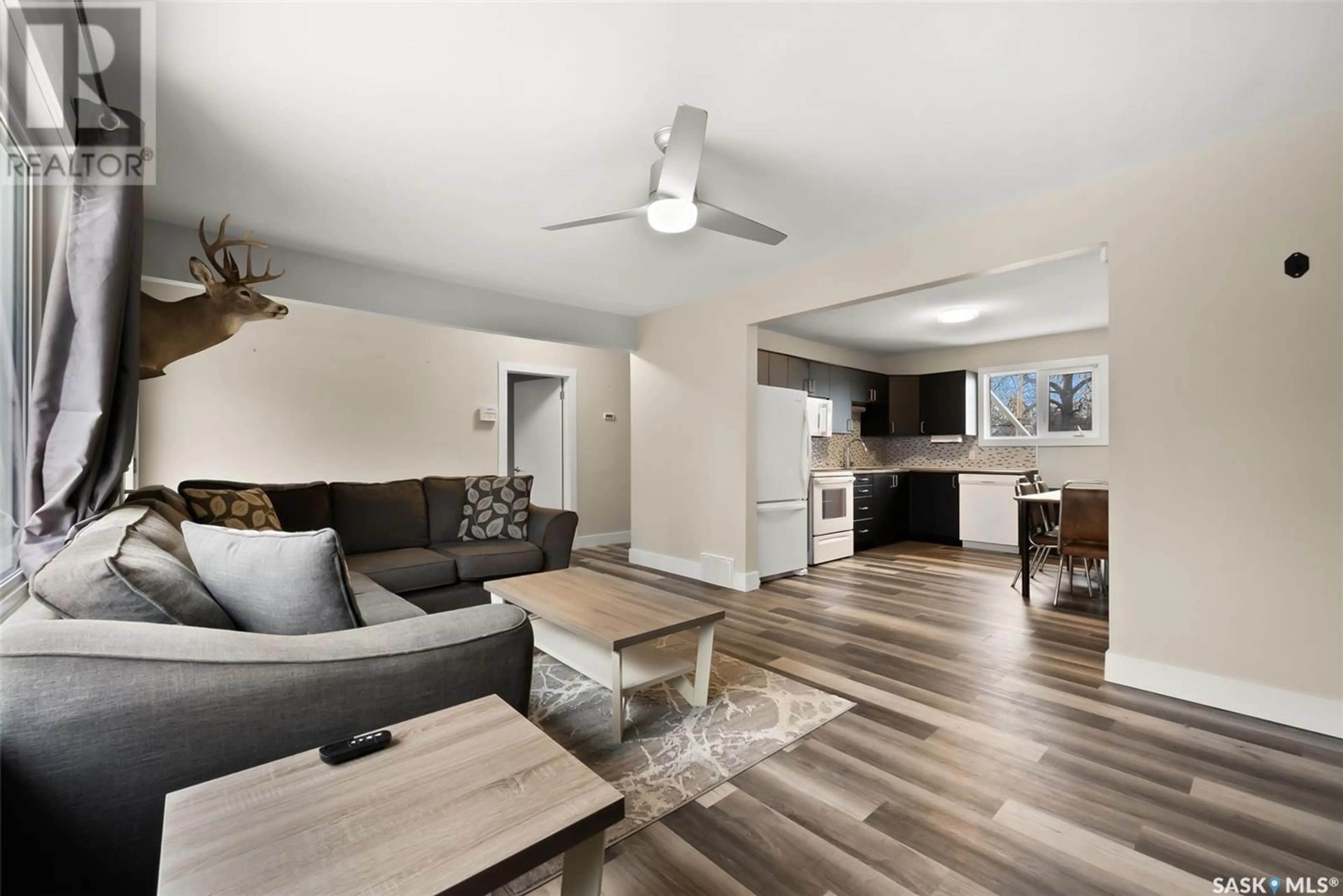 Living room with furniture, wood/laminate floor for 925 FORGET STREET, Regina Saskatchewan S4T4X7