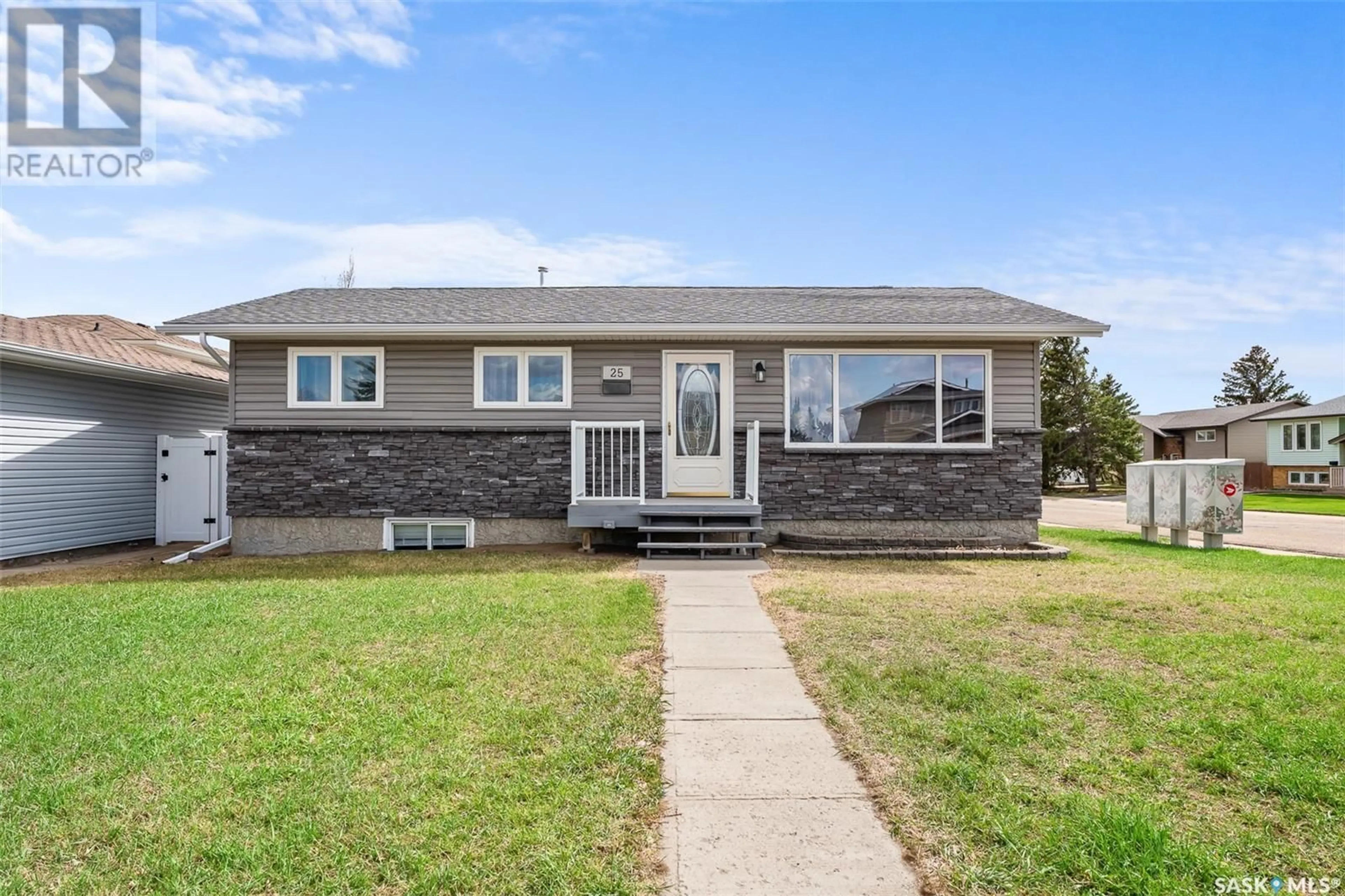 Home with vinyl exterior material, street for 25 WELLINGTON DRIVE, Moose Jaw Saskatchewan S6K1A2