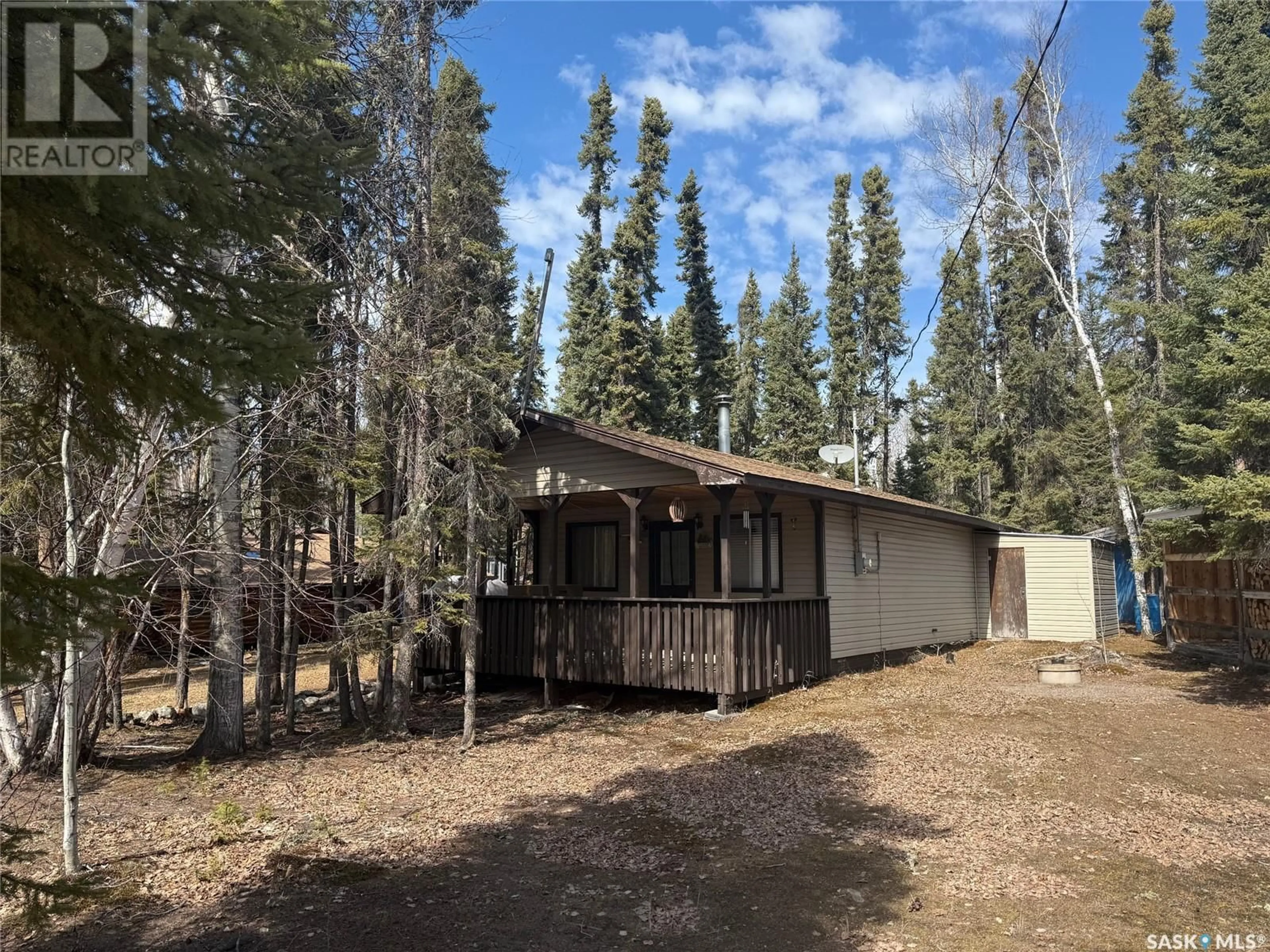 A pic from outside/outdoor area/front of a property/back of a property/a pic from drone, forest/trees view for 404 WILLOW STREET, Northern Admin District Saskatchewan S0J1L0