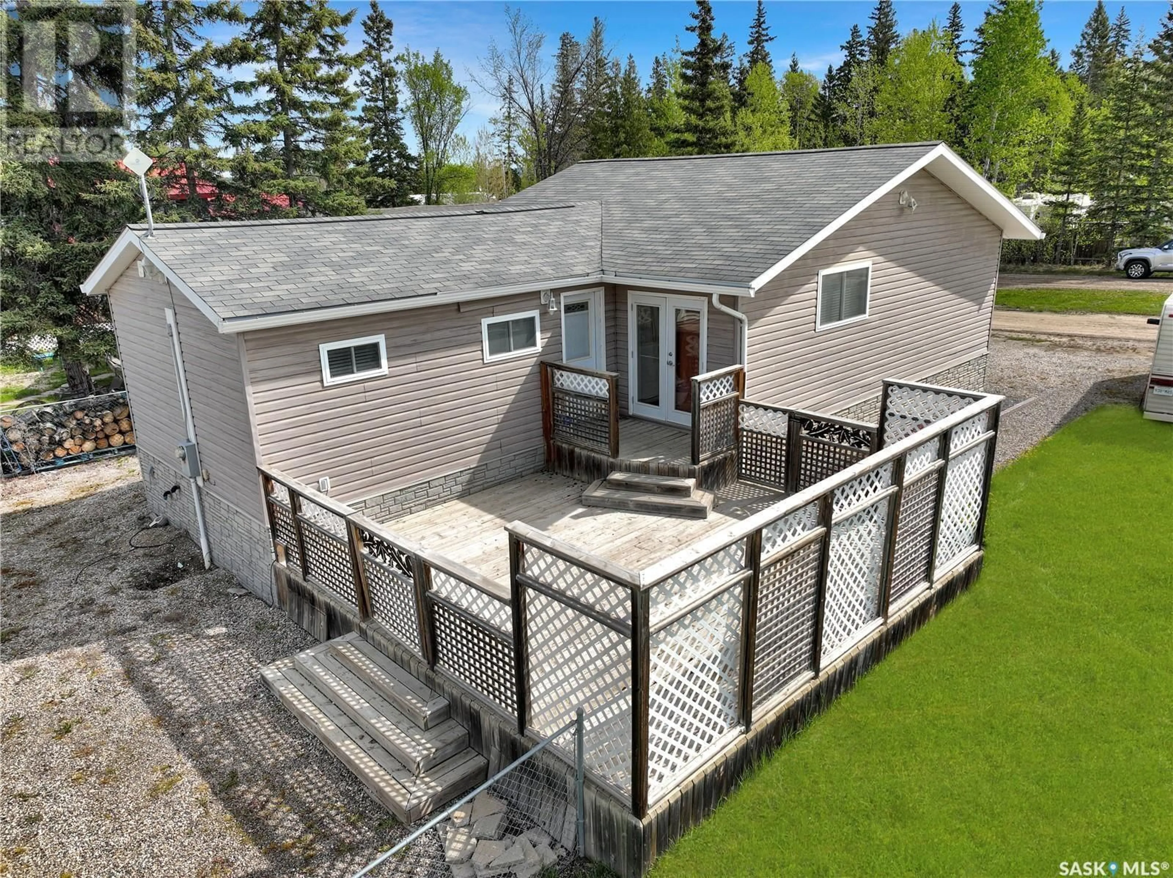 A pic from outside/outdoor area/front of a property/back of a property/a pic from drone, unknown for 502 SOUTHSHORE DRIVE, Emma Lake Saskatchewan S0J0N0