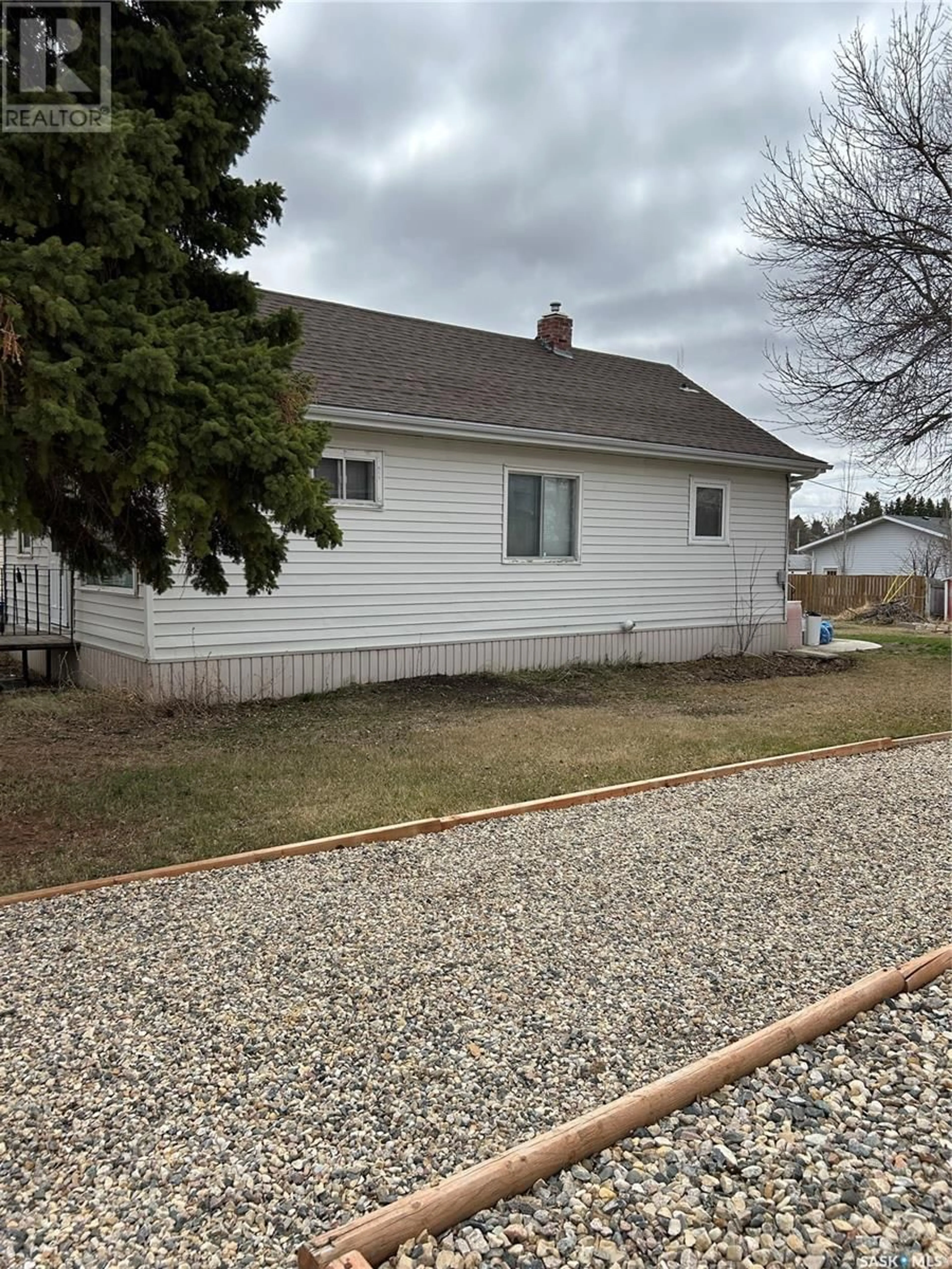 Home with vinyl exterior material, street for 103 3RD AVENUE, Kelvington Saskatchewan S0A1W0