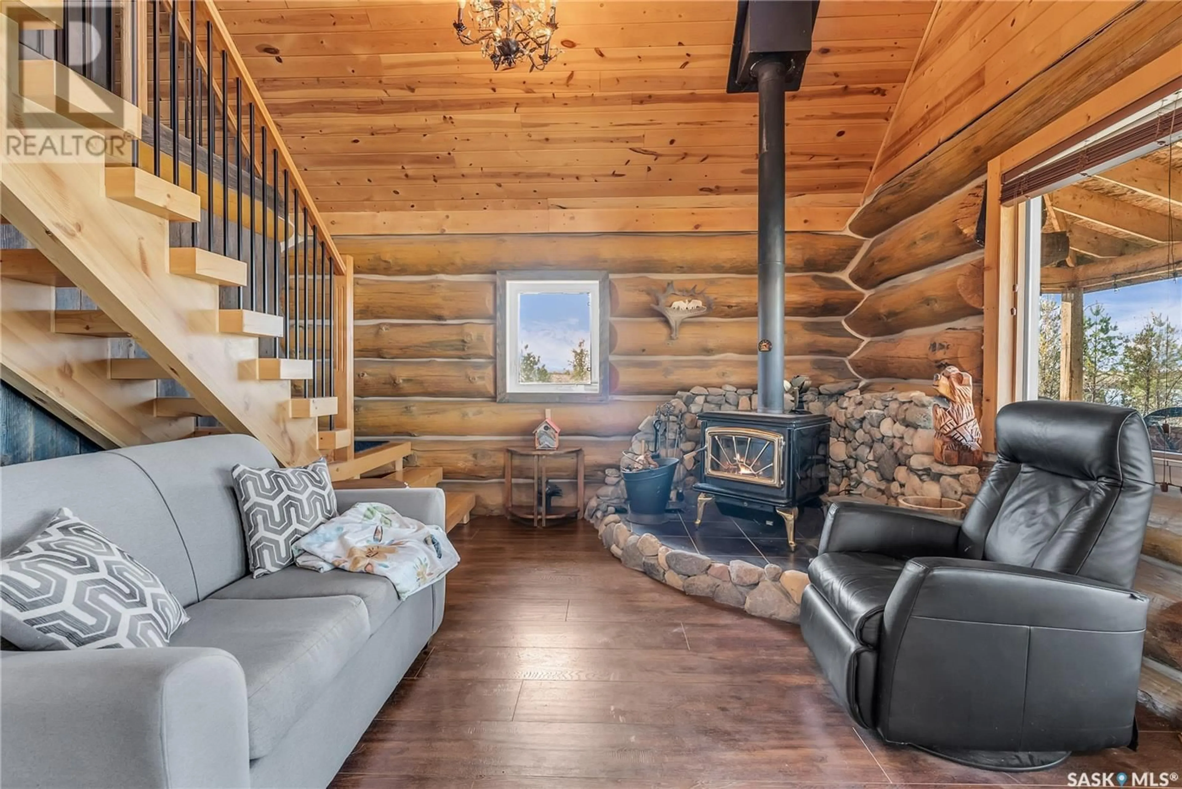 Living room with furniture, wood/laminate floor for BLUE HERON GARDENS, Fish Creek Rm No. 402 Saskatchewan S0K1B0